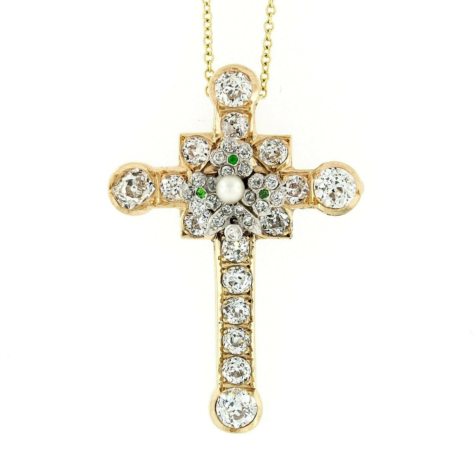 Here we have an absolutely stunning antique cross pendant that was crafted from solid 18k yellow and white gold during the Edwardian era. It truly stands out with its 4 large old mine cut diamonds totaling approximately 1.52 carats in weight, each