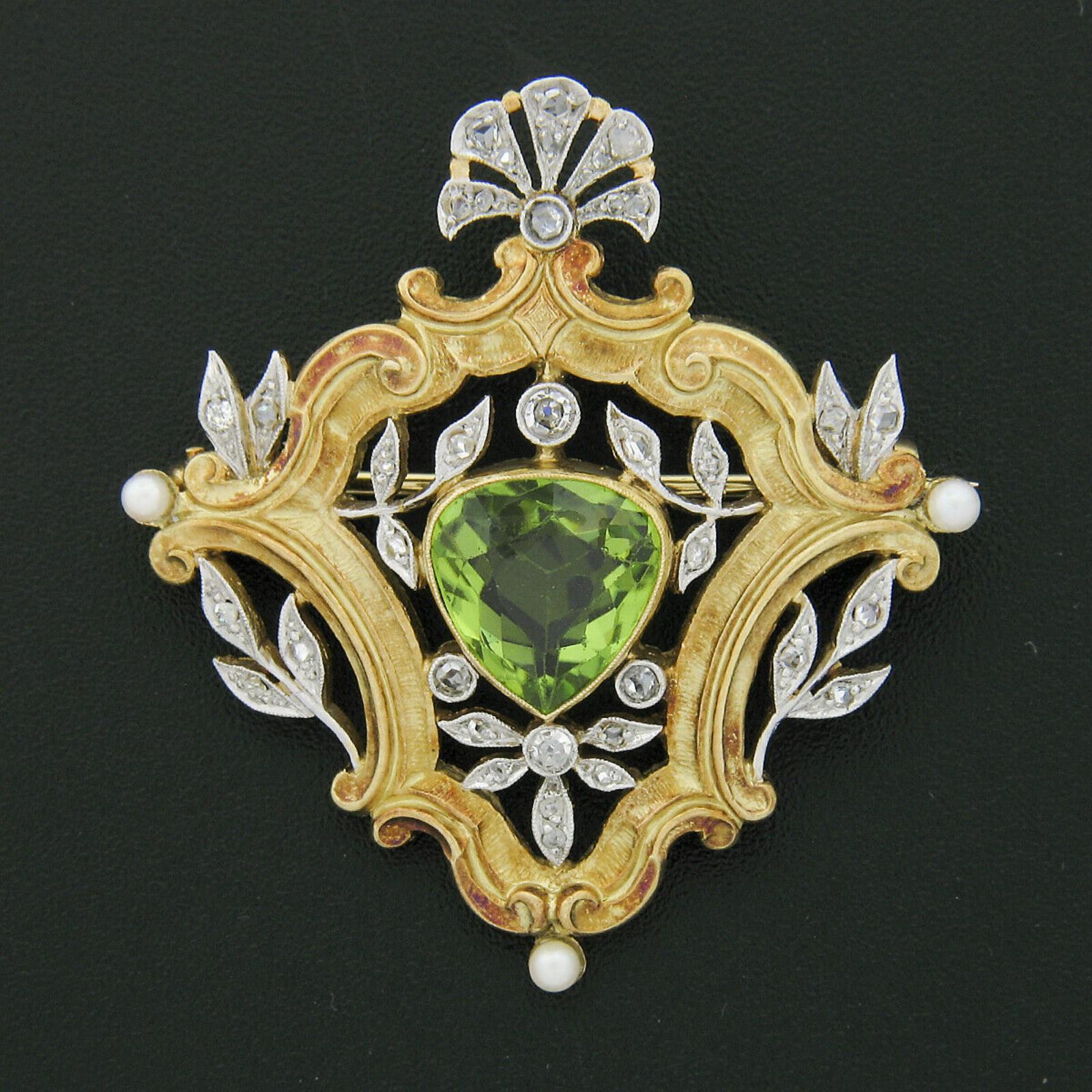 Here we have a magnificent antique brooch that was crafted from solid 18k yellow gold with platinum top during the Edwardian era. The brooch features an approximately 3.68 carat, GIA certified, natural peridot with a rich and pleasing yellow-green