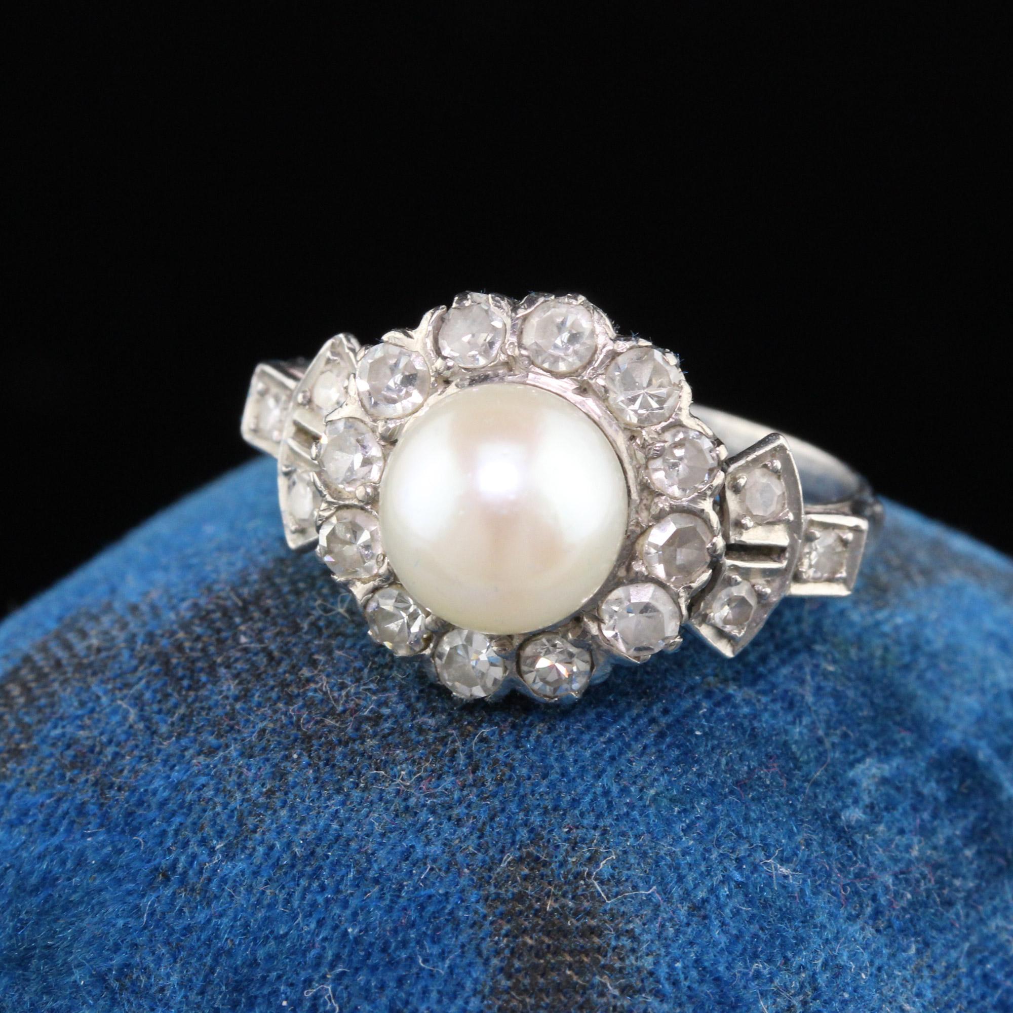 Gorgeous Edwardian White Gold & Platinum Engagement ring featuring a pearl in the center surrounded by a halo of lively single cut diamonds.

#R0235

Metal: 18K White Gold & Platinum

Weight: 4.3 Grams

Pearl: Measures approximately 7.2 mm in