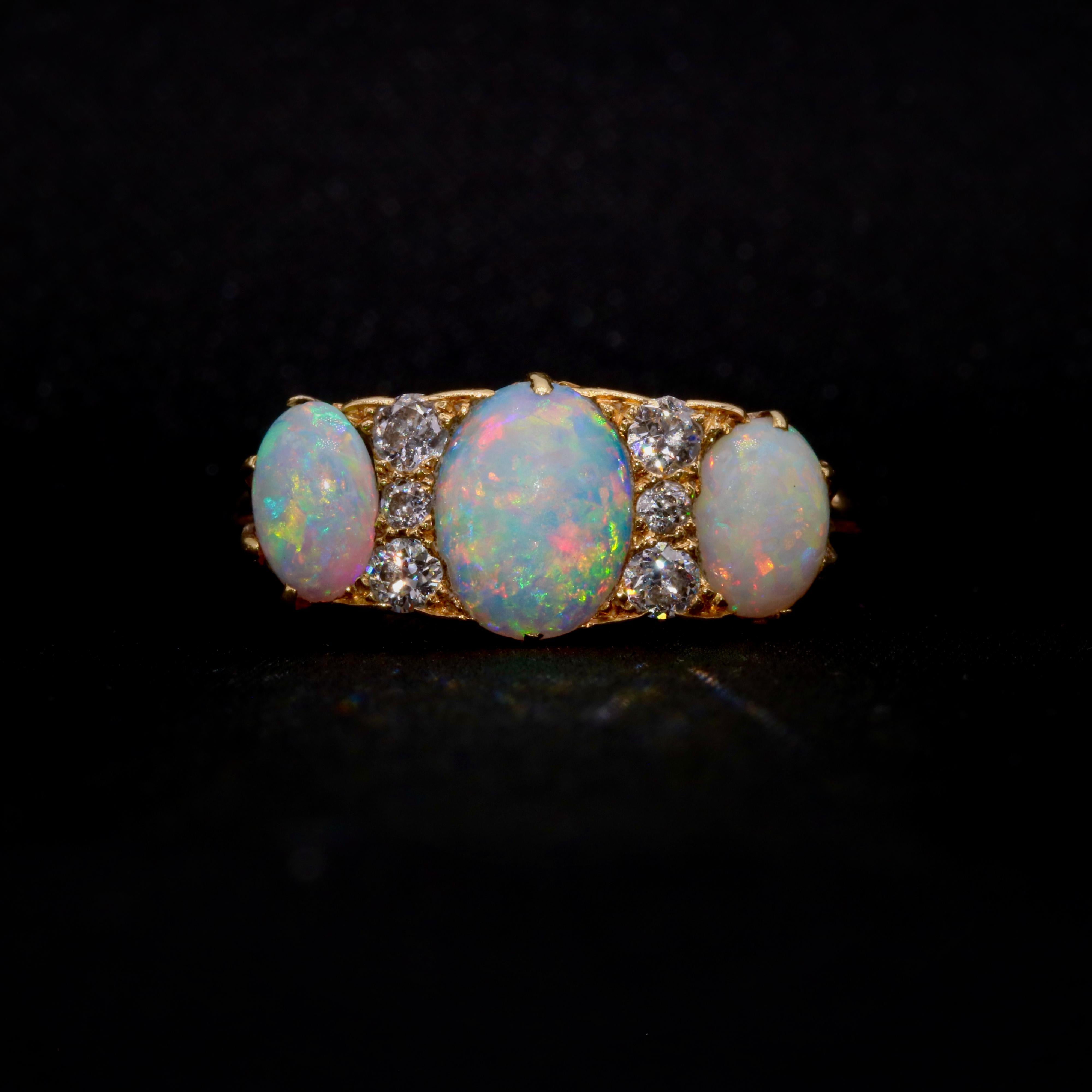 An antique opal, diamond, and yellow gold ring, comprising six old cut diamonds, and three oval opal cabochons, in 18 karat yellow gold. 

My favourite thing about this Edwardian18K Yellow Gold Opal and Diamond Ring, is the is the beautiful