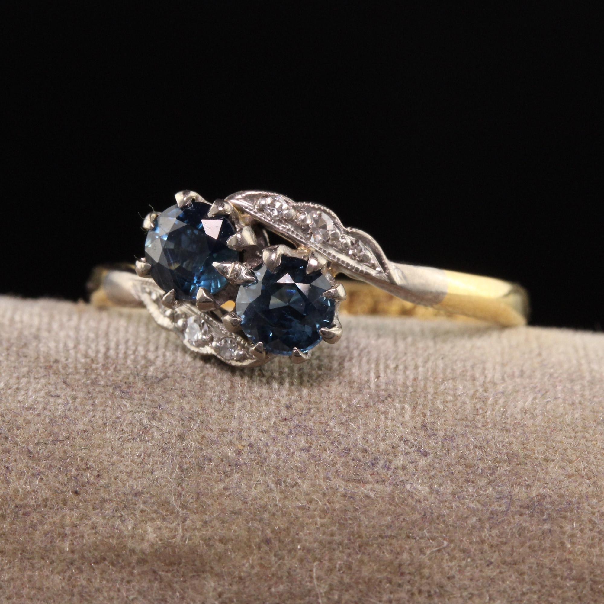 Beautiful Antique Edwardian 18K Yellow Gold and Platinum Toi et Moi Sapphire Diamond Ring. This beautiful ring is crafted in 18k yellow gold and platinum. It has two beautiful sapphires in the center with single cut diamonds on the sides.

Item