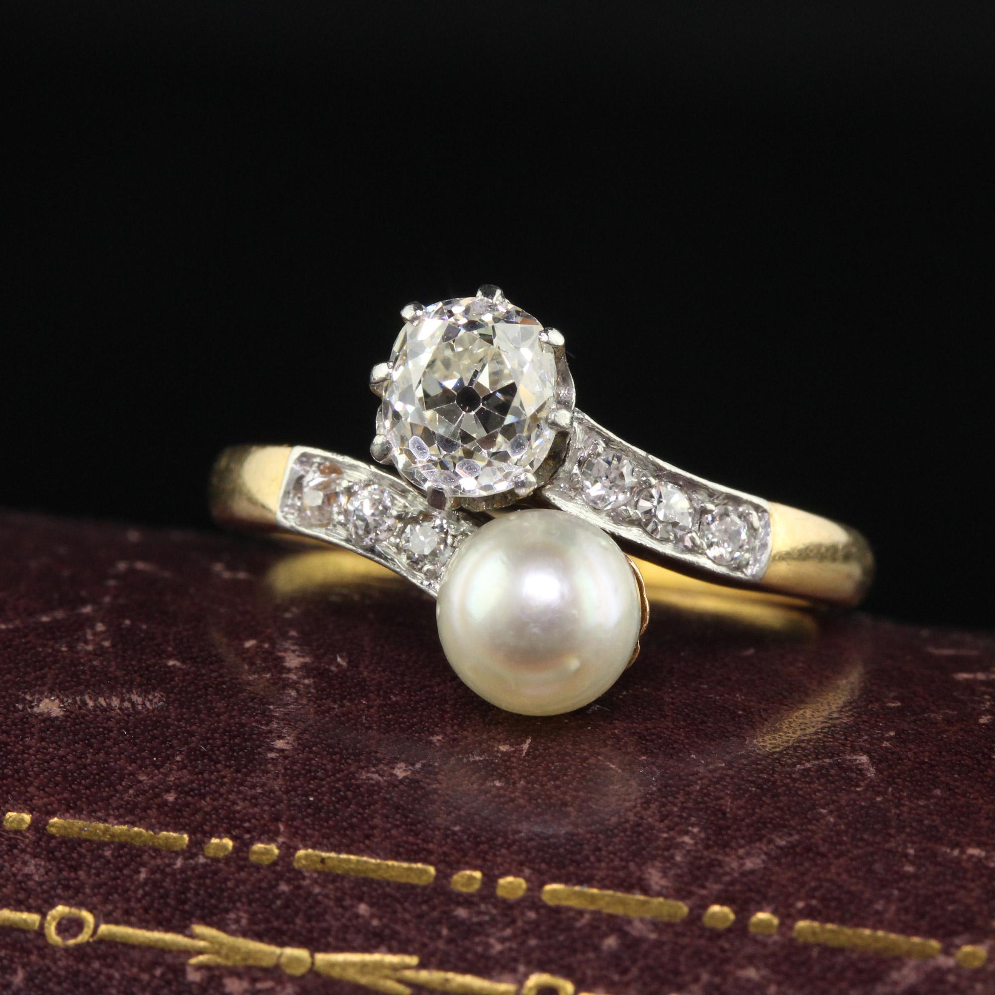 Beautiful Antique Edwardian 18K Yellow Gold Old Mine Cut Diamond and Pearl Toi et Moi Engagement Ring. This classic Toi et Moi engagement ring is crafted in 18k yellow gold and platinum top. The ring holds a chunky old mine cut diamond on one side
