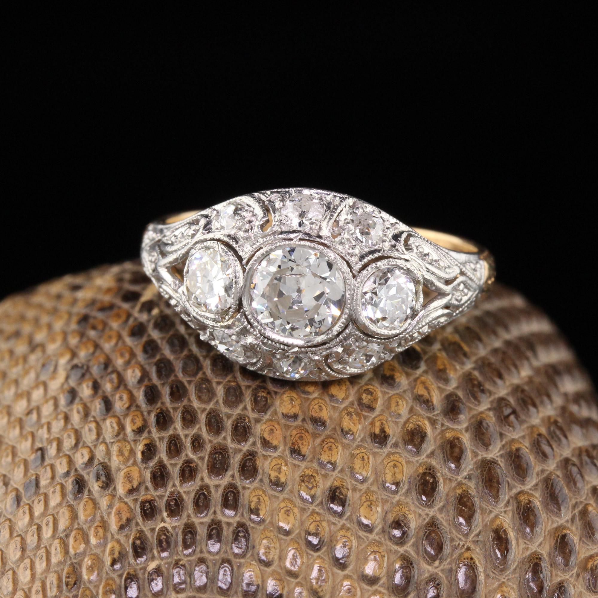 Stunning Edwardian Engagement ring with 3 old cut diamonds bezel set with beautiful filigree work and smaller diamonds surrounding. Platinum top with a yellow gold shank. Sits nice and low to the finger. In excellent condition.

Item #R0385

Metal: