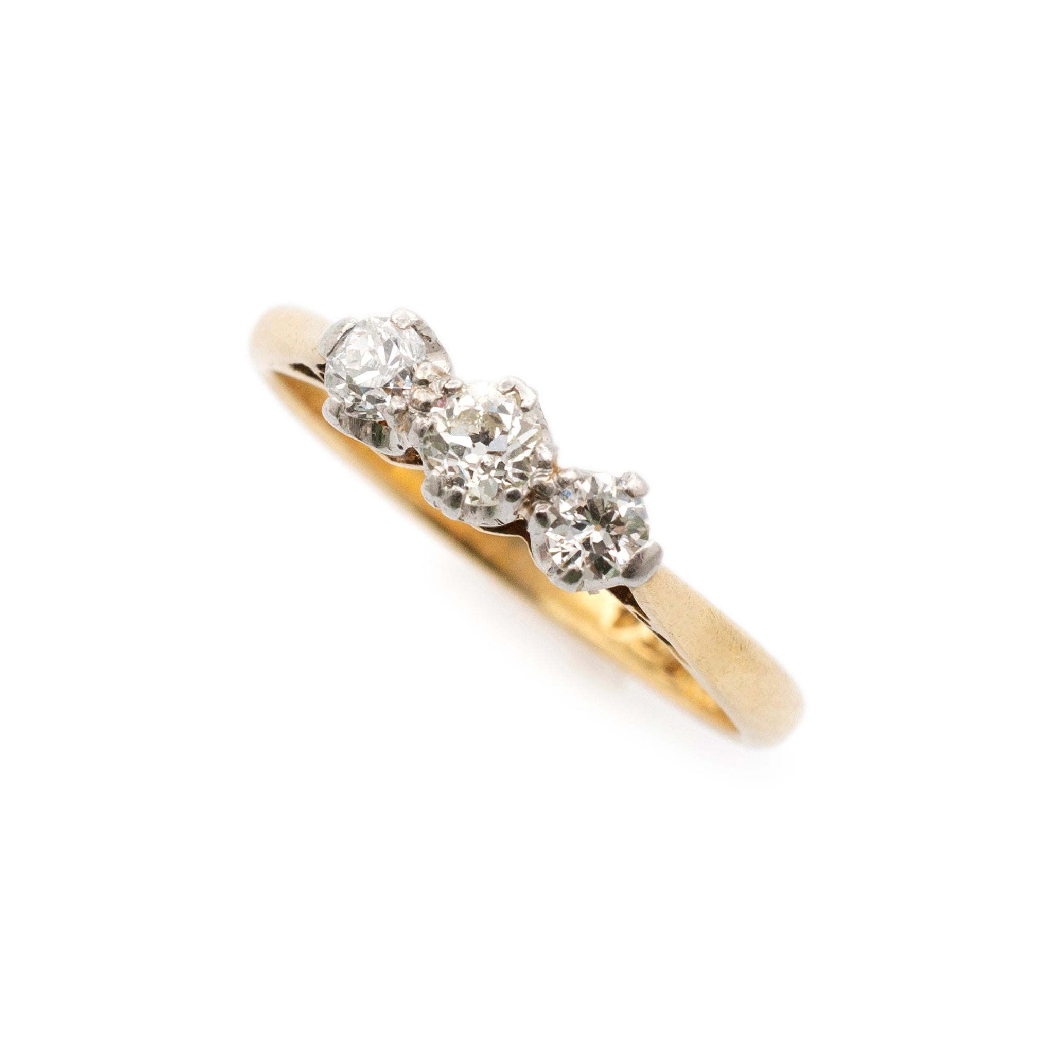 Gender: Ladies

Metal Type: 18K Yellow Gold & Platinum

Size: 7.25

Shank Maximum Width: 2.30 mm

Weight: 2.90 Grams

Ladies handmade hand engraved filigree-style 18K yellow gold and platinum three-stone diamond edwardian (1901-1920) three-stone