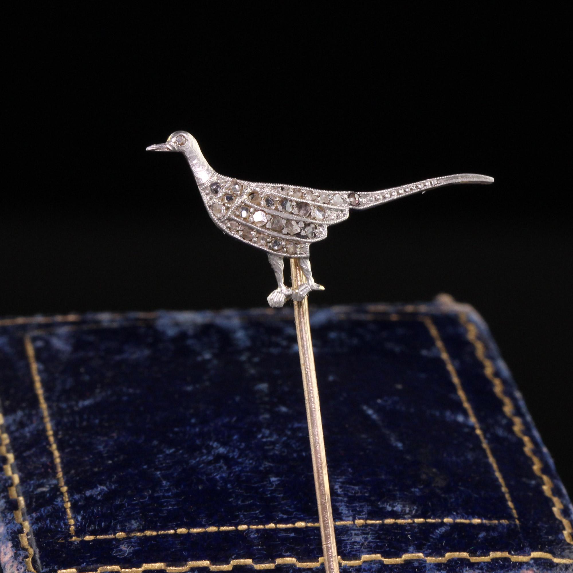 Beautiful Antique Edwardian 18K Yellow Gold Platinum Top Rose Cut Diamond Bird Stick Pin. This beautiful stick pin is crafted in 18k yellow gold and platinum top. The pin portion appears to be 14k yellow gold. The bird has rose cut diamonds set on