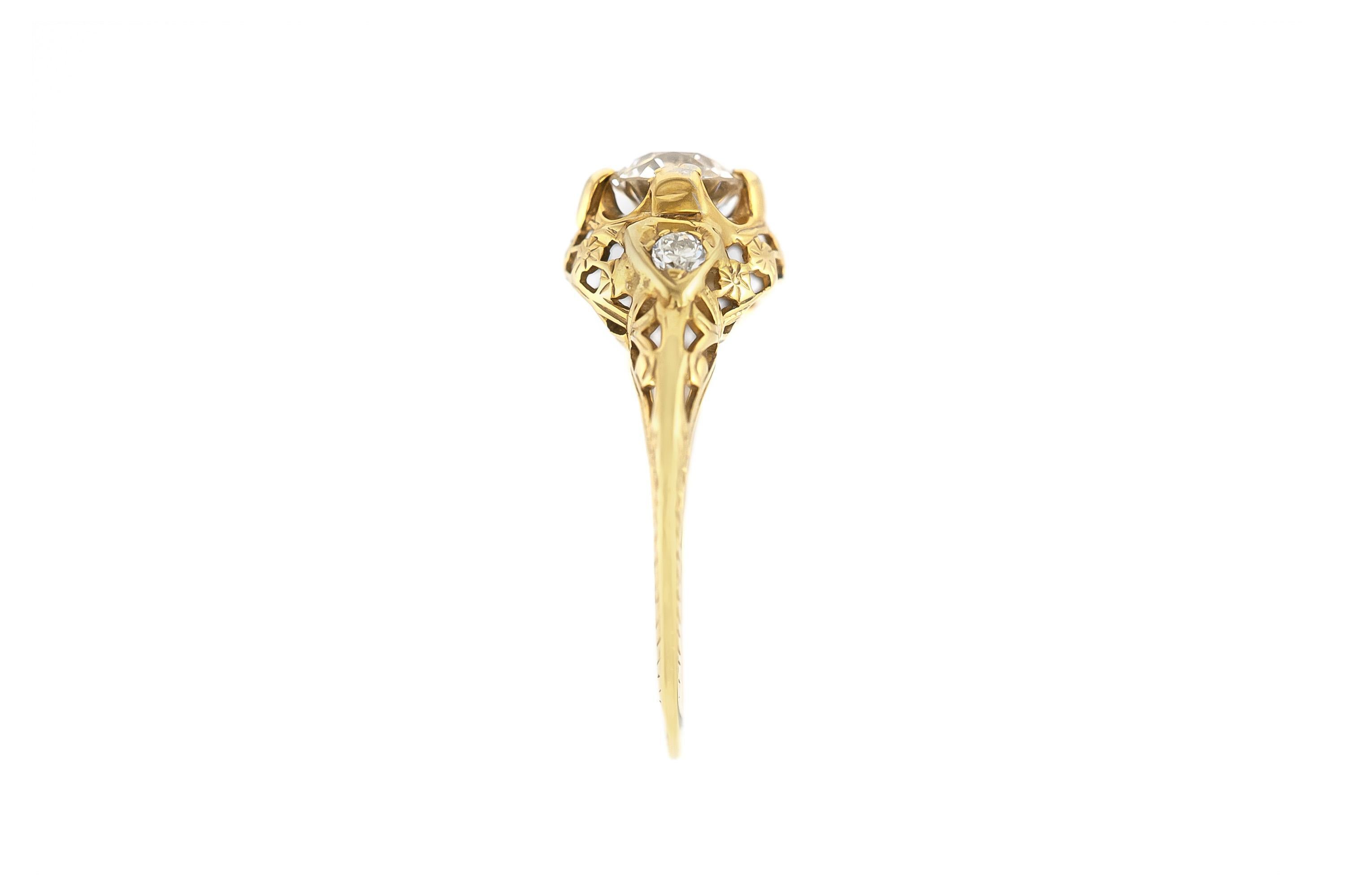 Finely crafted in 14k yellow gold with an Old European cut Diamond weighing approximately 0.80 carat and a pair of accenting Old European cut Diamonds weighing a total of approximately 0.10 carat.
Circa early 1900s
Size 6 3/4, resizable