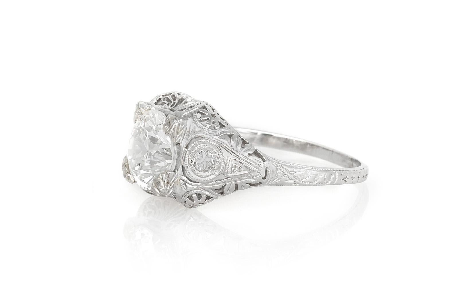 Finely crafted in platinum with an Old European cut Diamond weighing 1.79 carats, H color, SI2 clarity.
The ring features 2 accenting Round cut Diamonds on the setting.
Circa early 1900s
Size 8 1/4, resizable