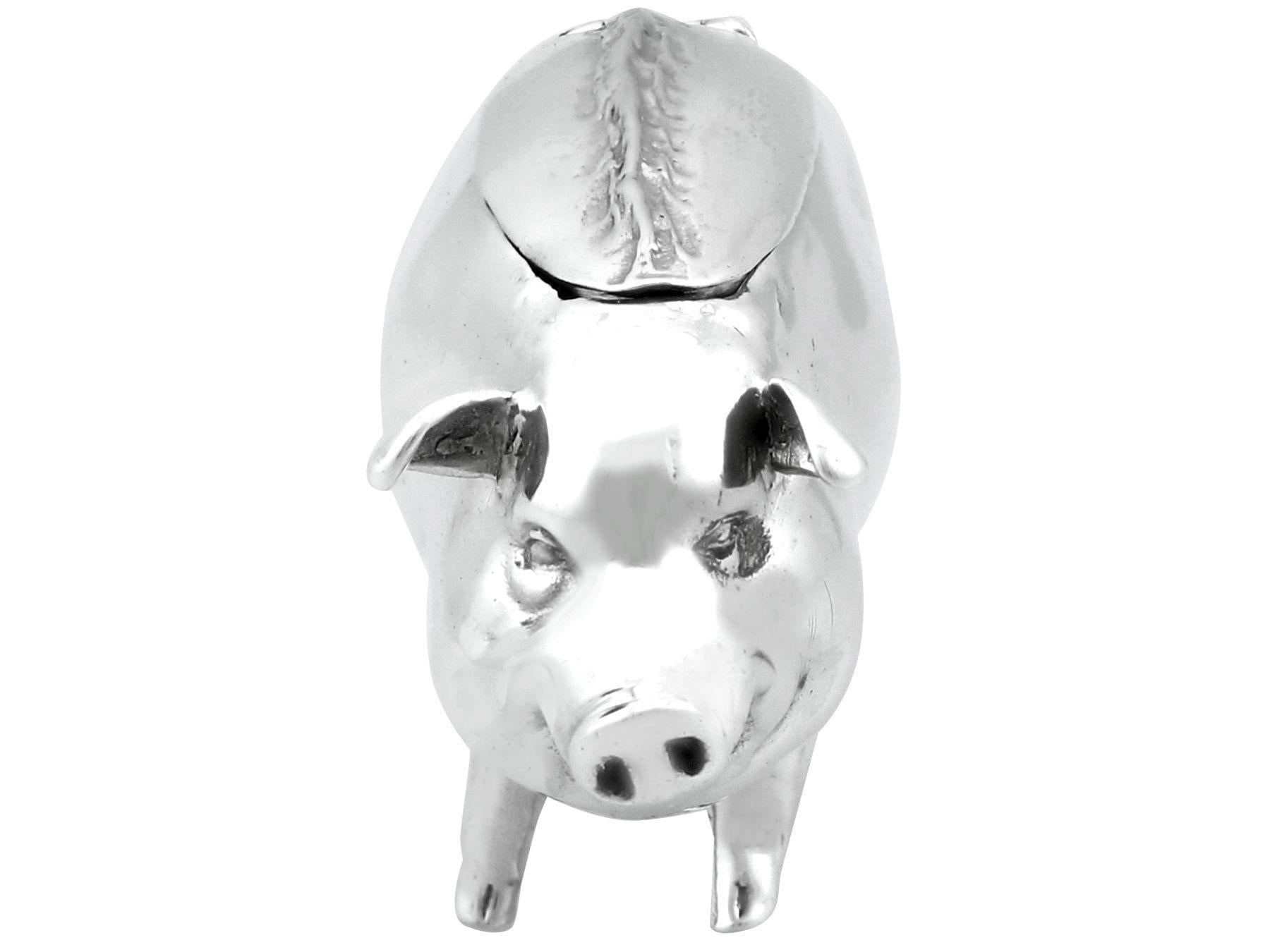 An exceptional, fine and impressive antique Edwardian English sterling silver vesta box modelled in the form of a pig; an addition to our ornamental silverware collection

This exceptional antique Edwardian sterling silver vesta box has been