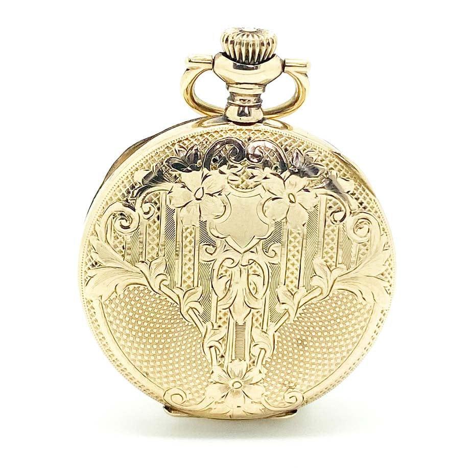 Antique pocket watch featuring a beautiful ornate design dating back to 1903. The watch has a number of makings indicating the piece was made by 'Waltham Watch Company' and it is 14k gold filled. 

The interior watch mechanism dates back to 1891 and
