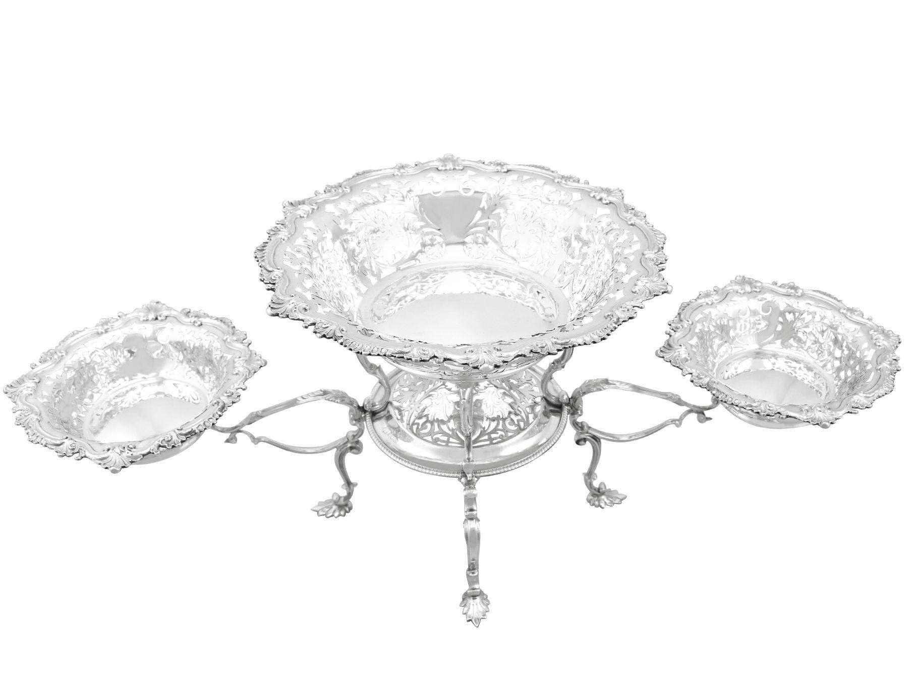An exceptional, fine and impressive antique Edwardian English sterling silver centrepiece; an addition to our ornamental silverware collection.

This exceptional antique Edwardian sterling silver centrepiece has a circular rounded form onto four