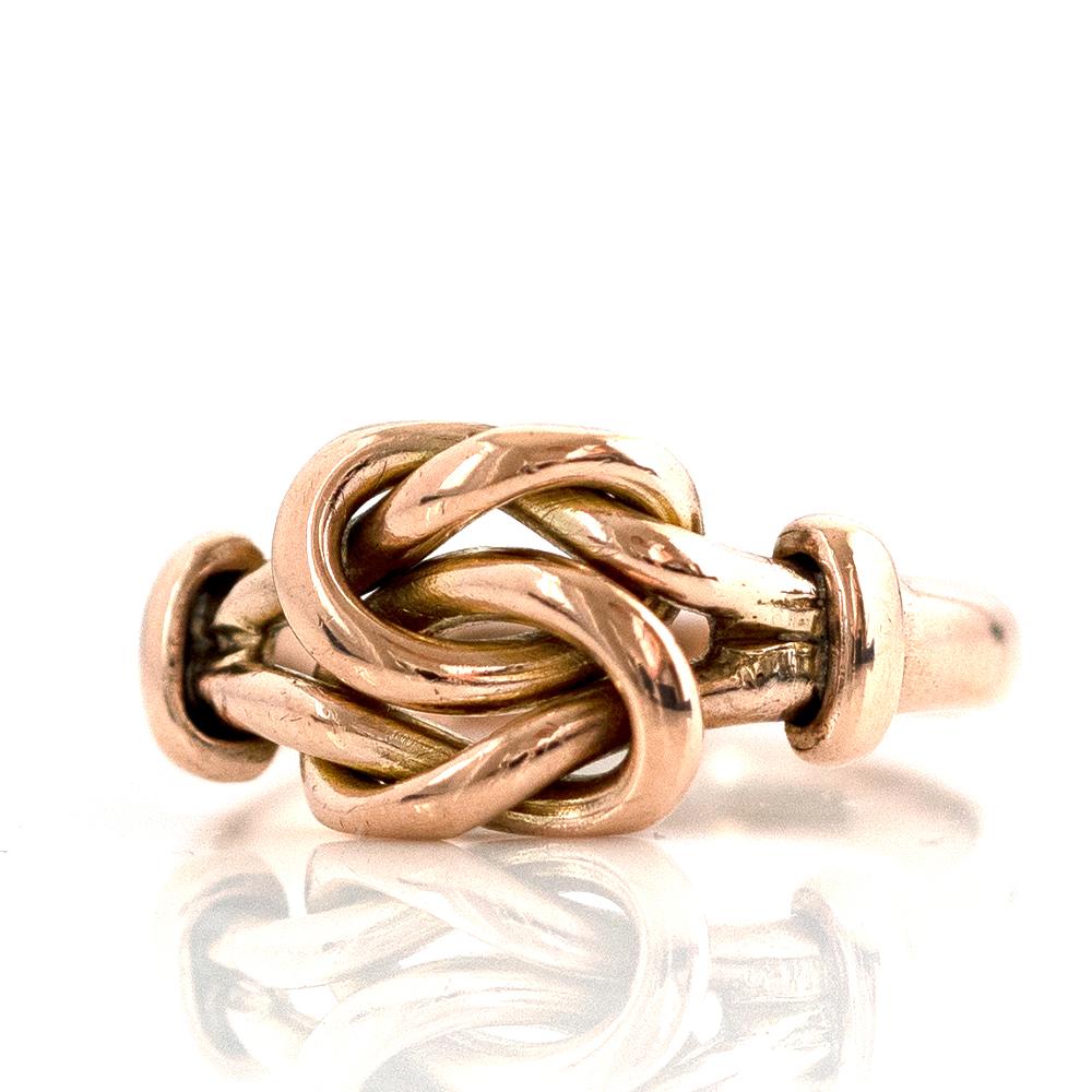 Our antique 1905 Lover's Knot ring is the most beautiful reminder of everlasting connection between two souls. The unique design features a looped love knot crafted from 9ct rose gold, this precious metal adds an extra touch of elegance and