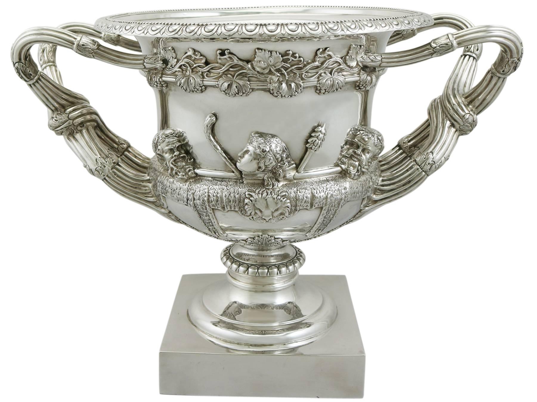 A magnificent, fine and impressive, large antique Edwardian English sterling silver Warwick vase; an addition to our silver presentation collection

This magnificent antique Edwardian sterling silver Warwick vase has a Campania shaped form onto a