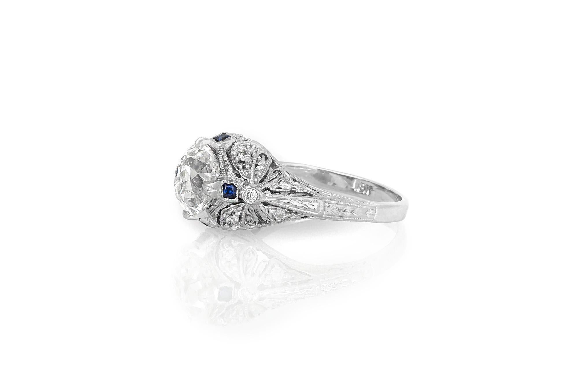 Finely crafted in 18K white gold with a GIA certified Old Mine cut Diamond weighing 2.37 carat, I color, SI1 clarity, GIA #12500962.
The ring features accenting Square-cut blue Sapphires and small Diamonds.
Circa 1910s
Size 6 3/4, resizable