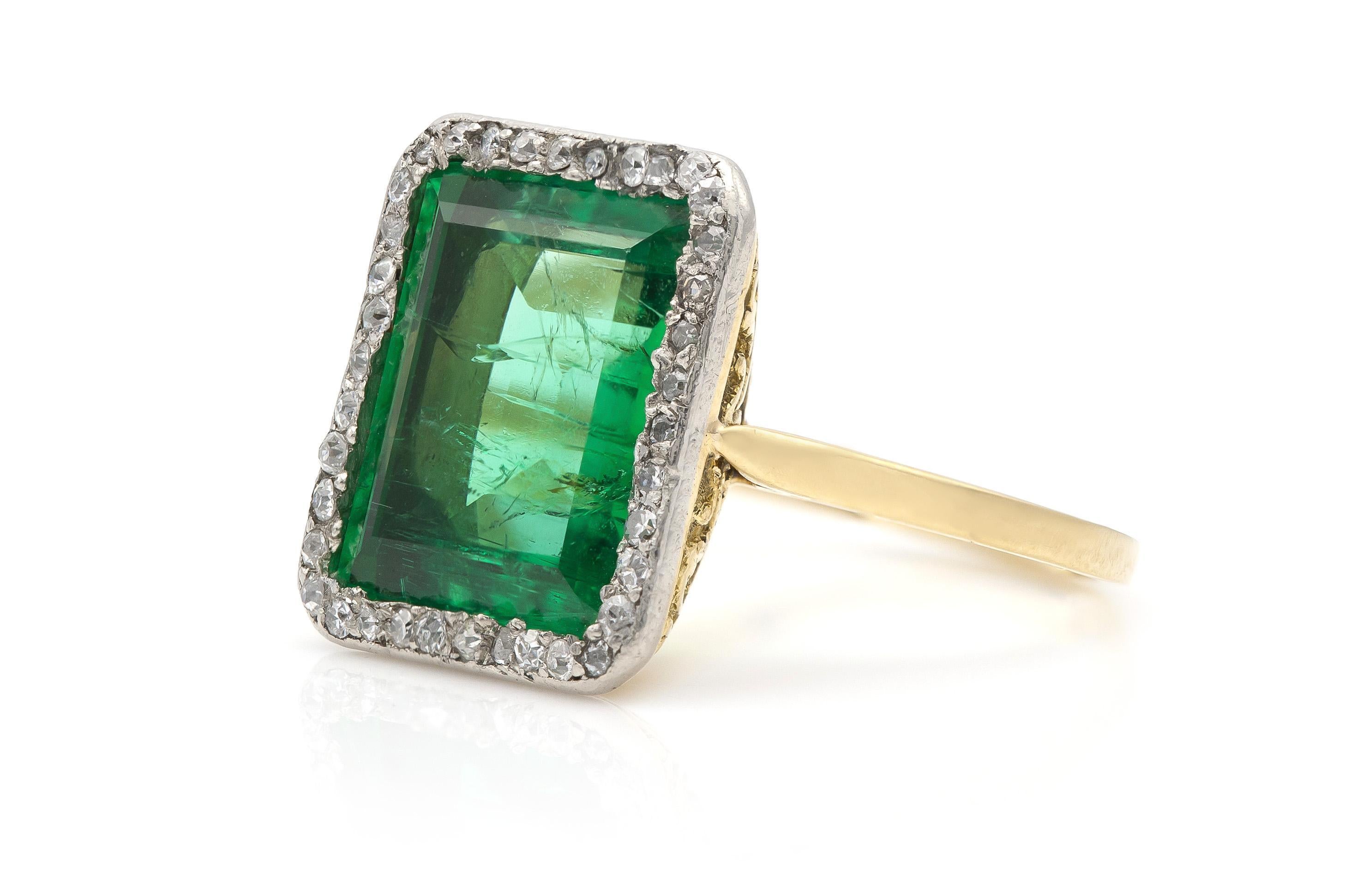 Finely crafted in 18k yellow gold and platinum with an AGL certified 7.20 carat Russian Emerald from Ural Mountains accented by Diamonds.
Circa 1910s
Size 7 1/4