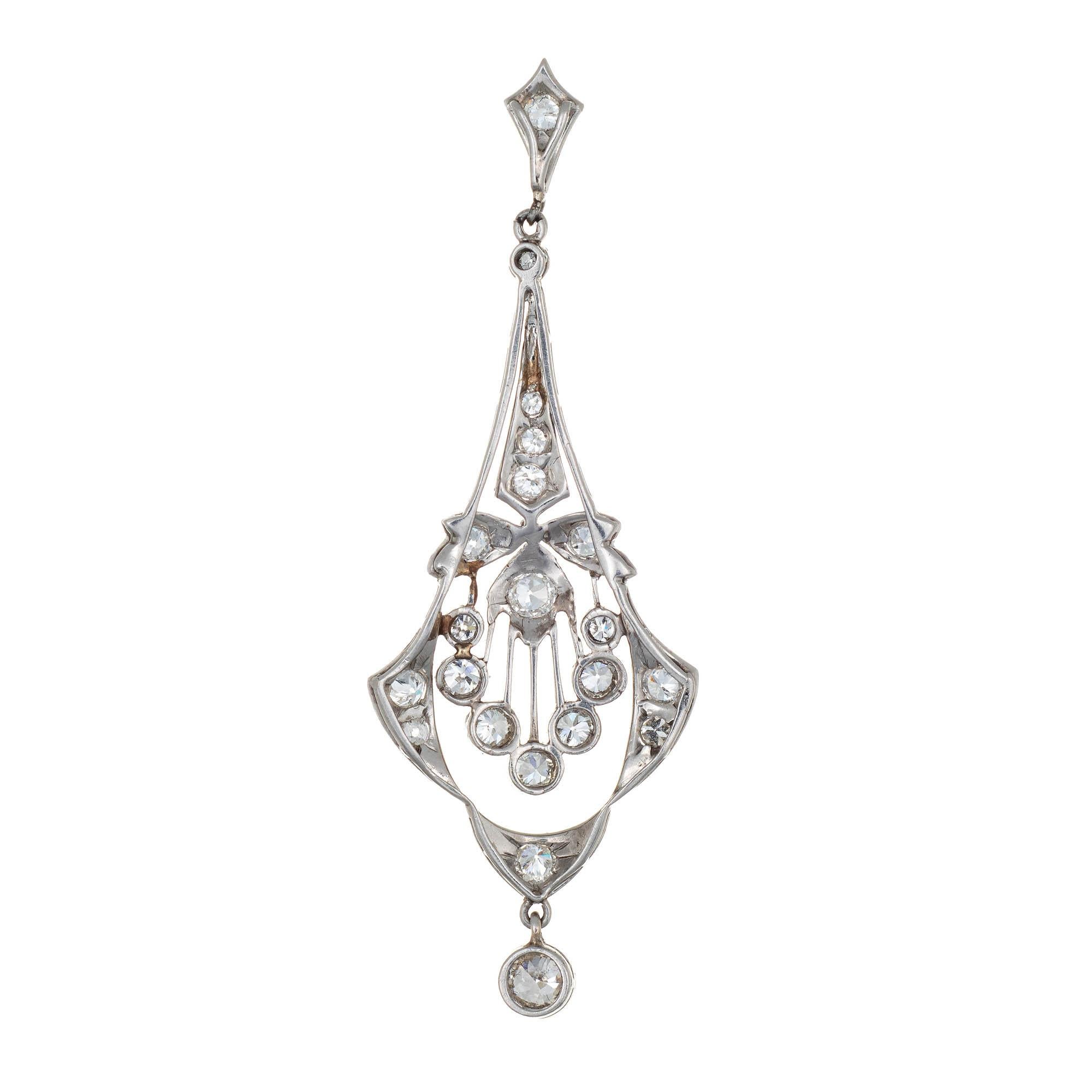 Finely detailed antique Edwardian diamond pendant crafted in platinum (circa 1910s to 1920s).  

Old European cut diamonds range in size from 0.01 to 0.10 carats and total an estimated 1 carat (estimated at H-I color and VS2-SI1 clarity). 

The