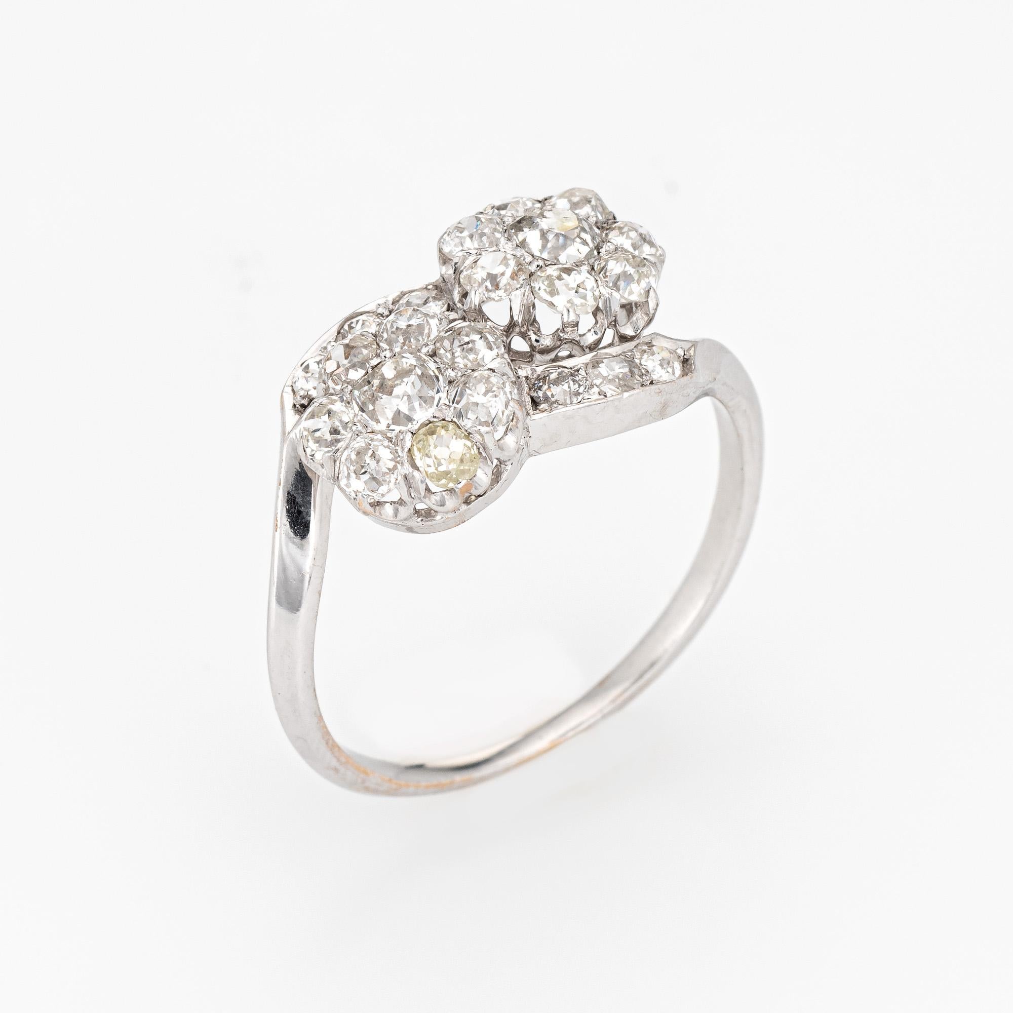 Finely detailed antique Edwardian diamond 'moi et toi' cluster ring crafted in 18k white gold (circa 1910s to 1920s).  

Old mine cut diamonds range in size from 0.03 to 0.15 carats and total an estimated 2 carats (estimated at K-L color and SI1-2