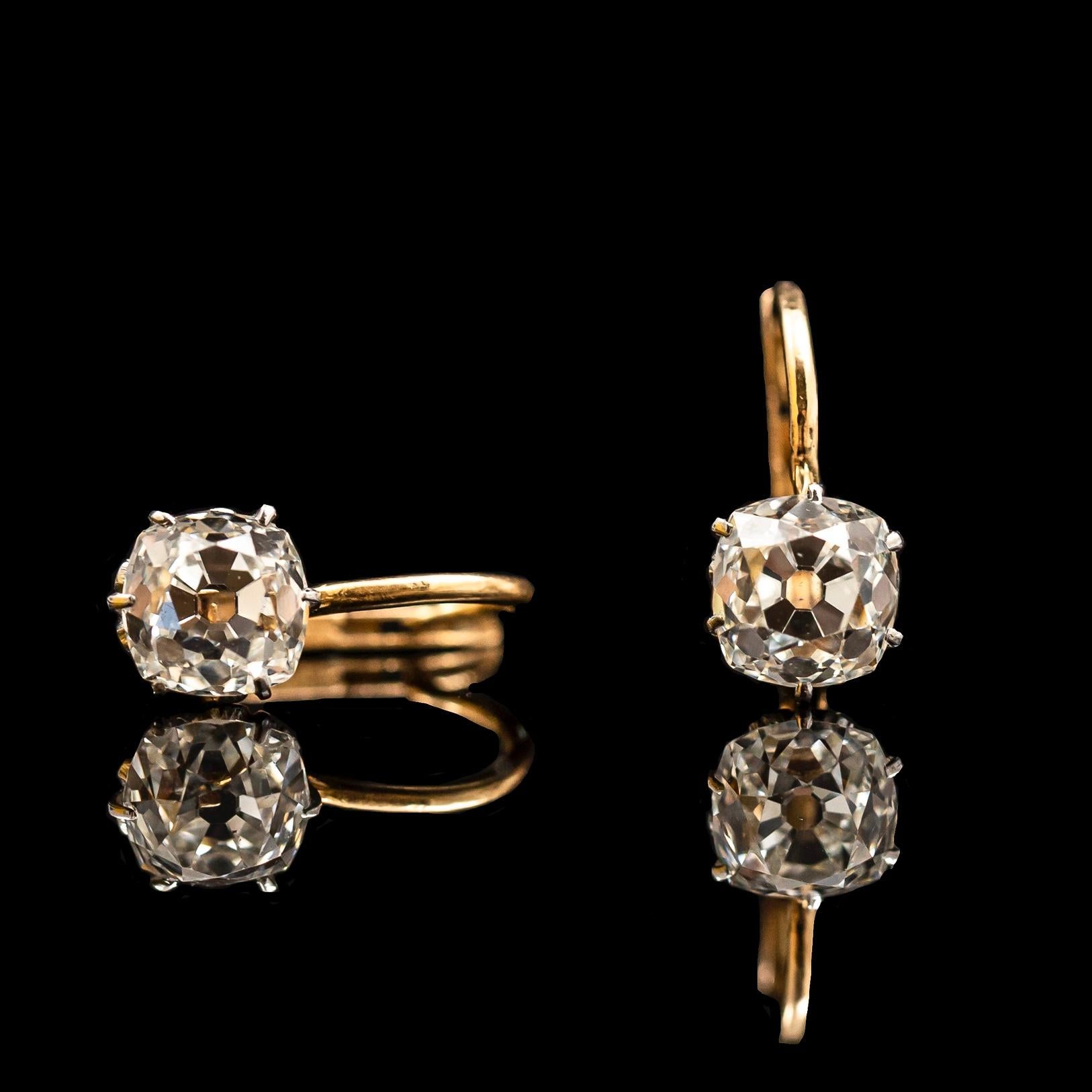 Antique Edwardian 3.4ct Old Mine-Cut Diamond Earrings in Yellow Gold, Portuguese, Hallmark and Maker’s Mark, Cased, circa 1917.

This early 20th century pair of earrings features two extremely sparkly and clear old-cut diamonds, with unrivaled charm