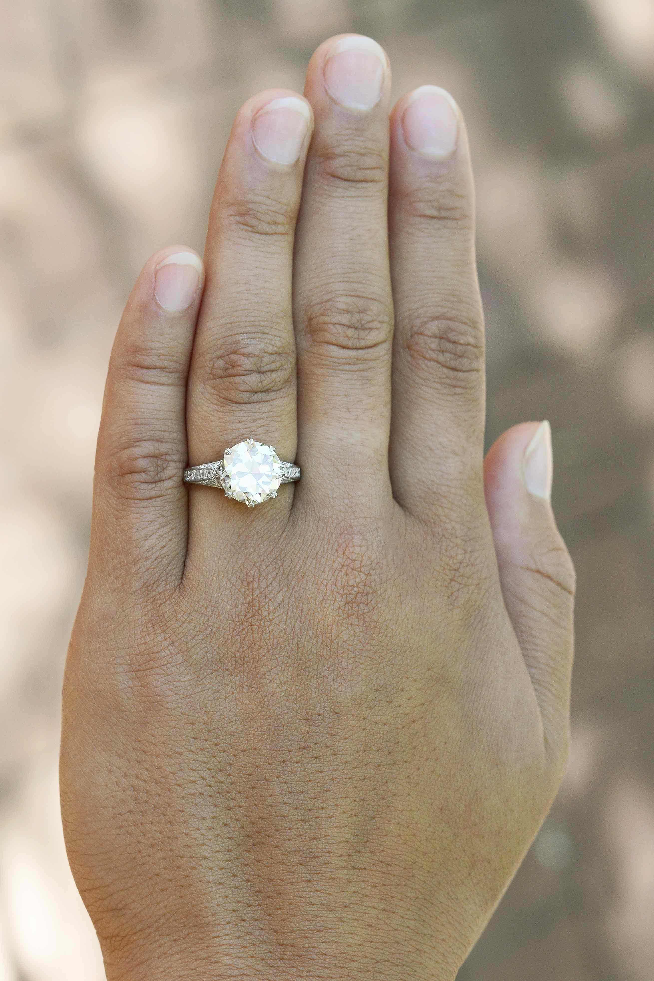 A glorious and large authentic antique Edwardian 4 carat (3.97) solitaire diamond engagement ring. Centered by an old European brilliant with larger facets that produce a most alluring, juicy scintillation not found in their modern counterparts.