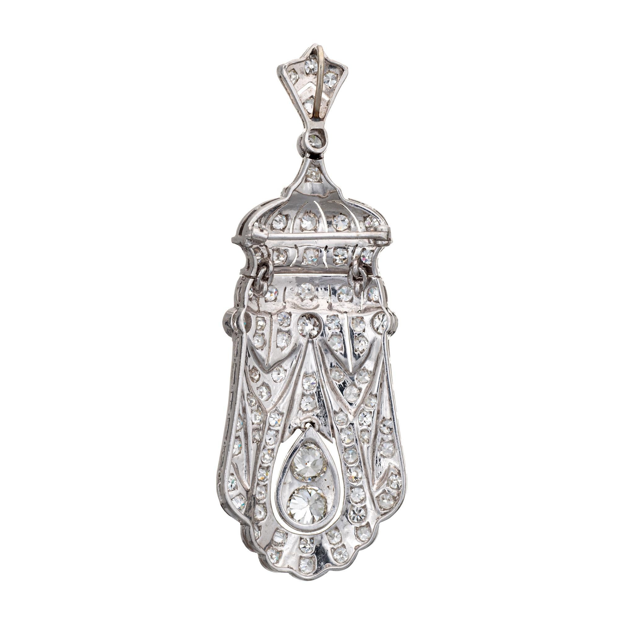 Finely detailed antique Edwardian diamond pendant crafted in platinum (circa 1910s to 1920s).  

Old European cut diamonds range in size from 0.05 to 0.75 carats and total an estimated 5.50 carats (estimated at I-J color and VS2-SI1 clarity). 

The