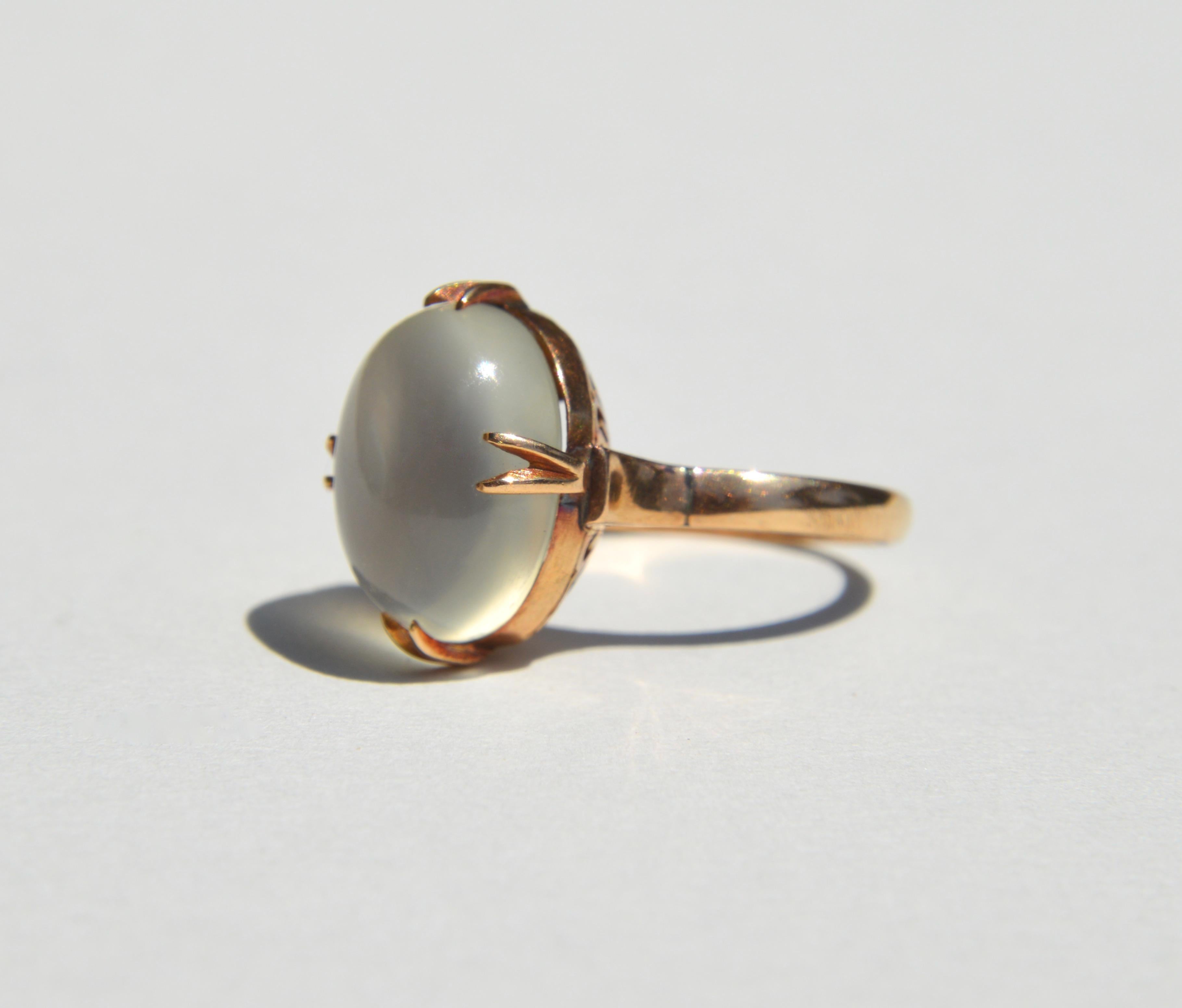Beautiful antique Edwardian era circa 1910s 6 Carat glowy moonstone cabochon 14K rosegold ring. Size 5.75, can be resized for an additional $40. Moonstone measures 13x10mm. Lovely claw prong setting. In good condition. 