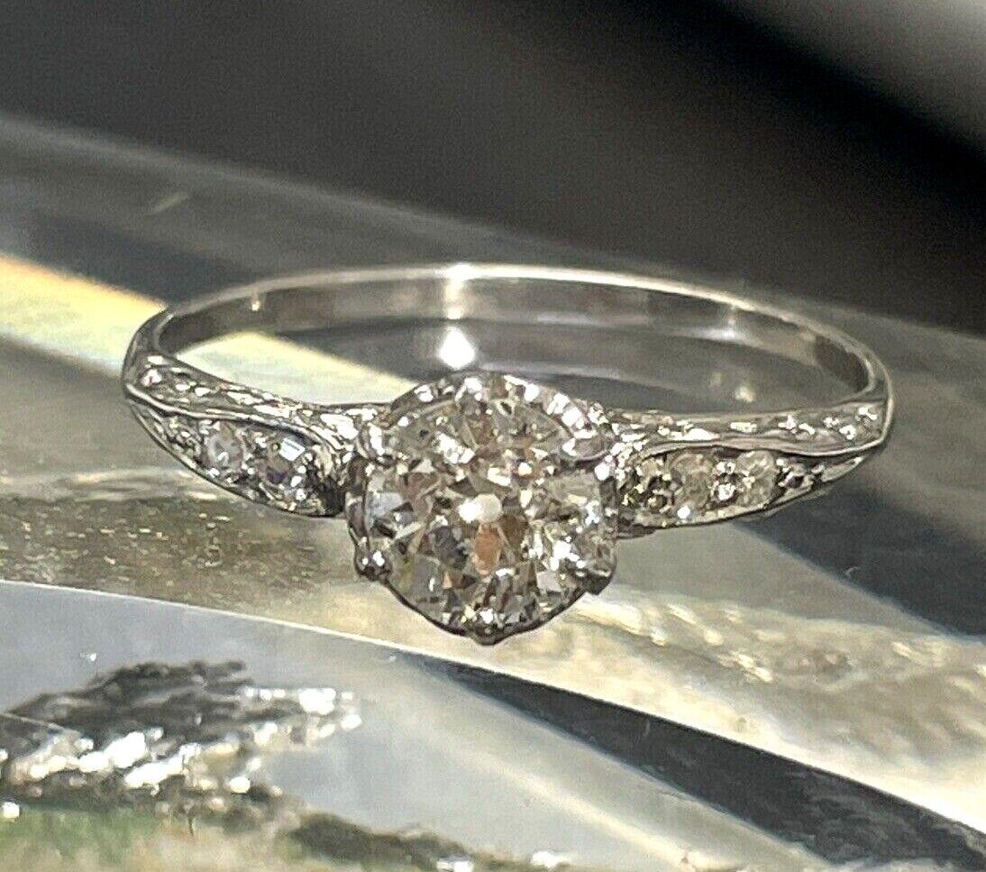 Presenting a:

Antique Edwardian .83CT Natural Old Mine Cut Diamond 18K White Gold Ring Sz 8.25

Featuring a delicate Edwardian 6 prong ring set with a natural and earthmiend old mine cut diamond, weighing approximately .83 carats.

The diamond is