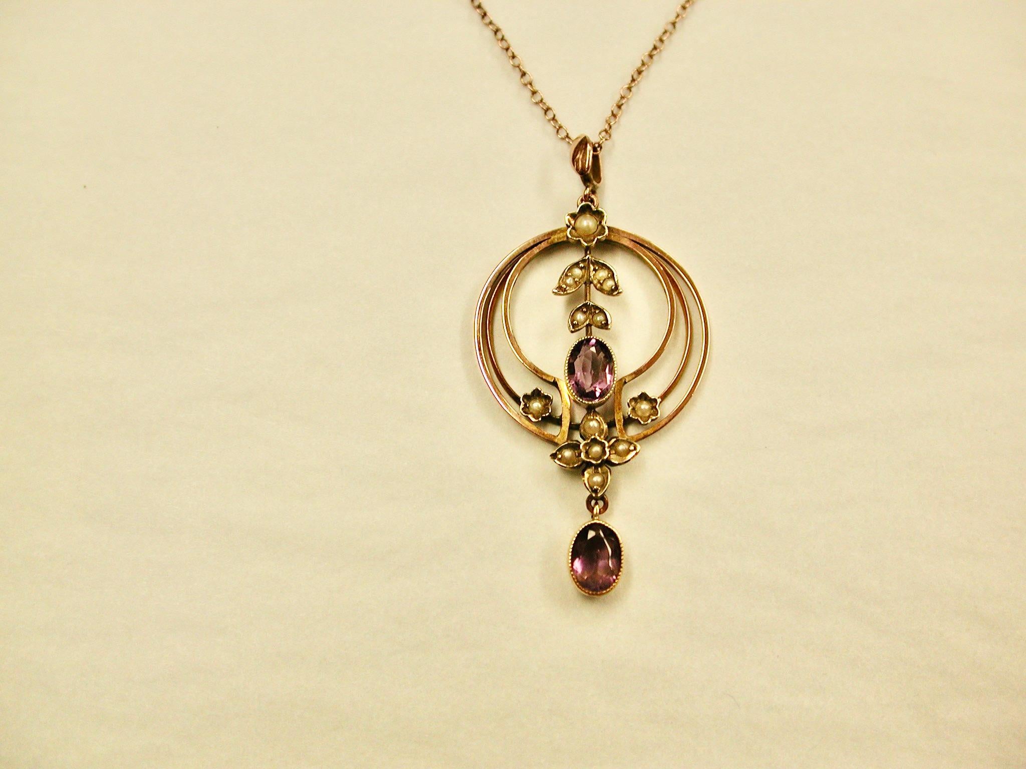 Antique Edwardian 9 Ct  Pink Gold Pendant & Chain,Set With Amethyst & Half Pearl, circa 1905
Original Chain with Barrel snap, length 15.5 Inches.
Gold,Pearls and Amethysts are in good condition