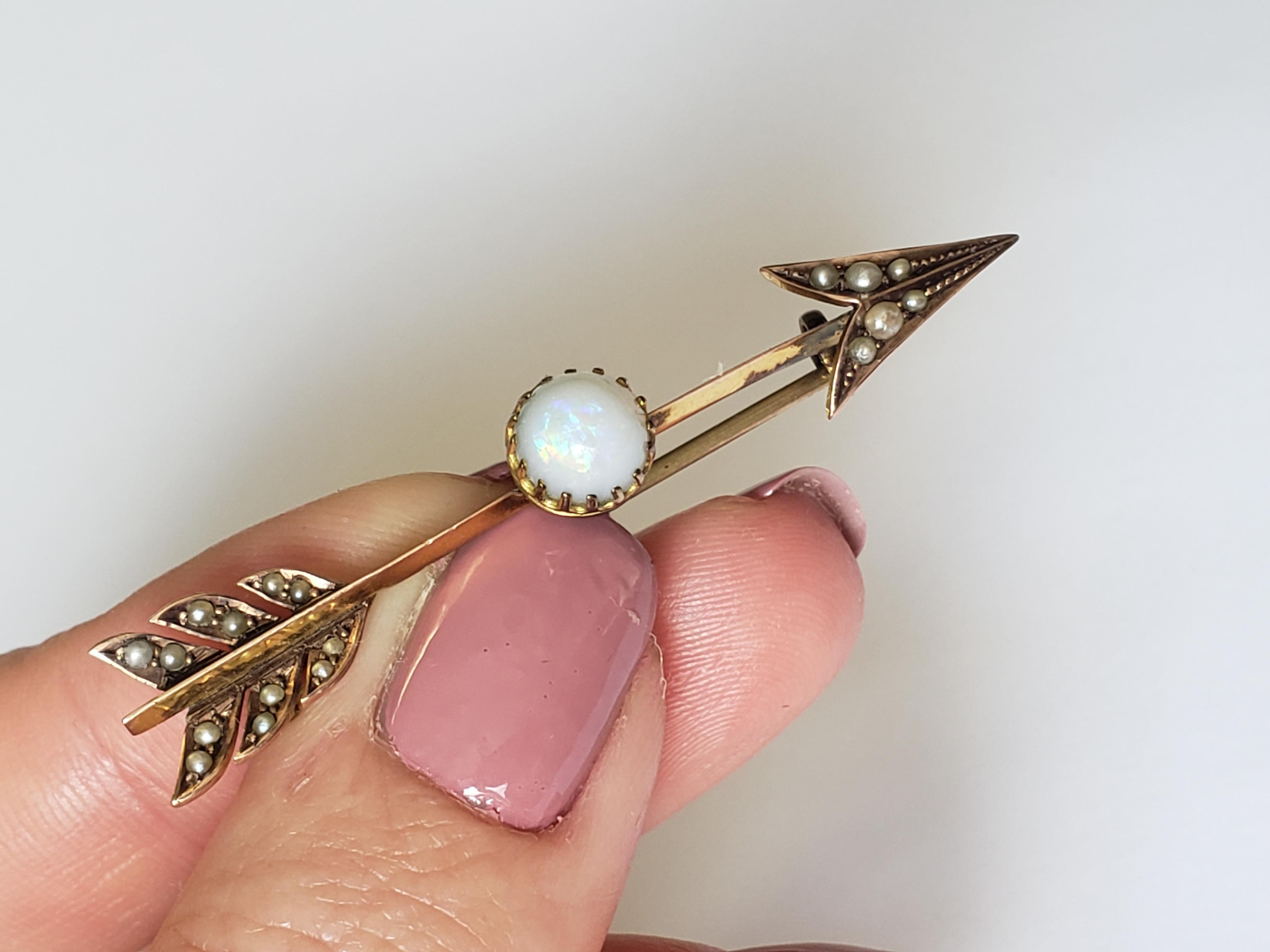 A Lovely Antique Edwardian c.1900 9 Carat Gold, Opal and Seed Pearl Arrow brooch. English origin.

Length 52mm, width 10mm.

Weight 2.8gr.

Marked 9CT for 9 Carat Gold.

Brooch in good condition, completed with stones and yellow metal pin.