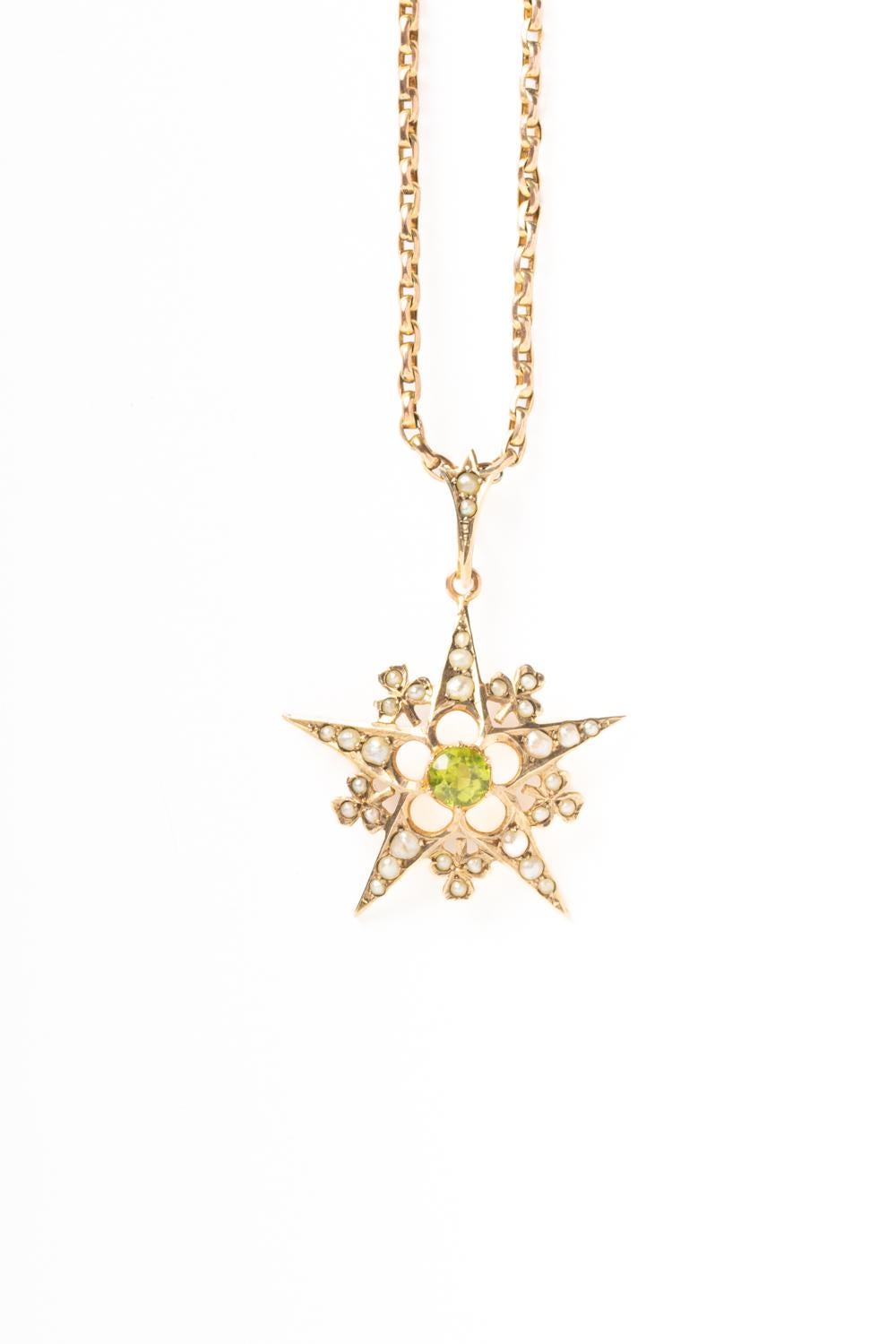 This beautiful antique Edwardian 9ct gold starburst pendant with peridot and seed pearls is more than 100 years old! This stunning Edwardian star design is set with a vibrant green peridot and 32 seed pearls including small loop. Peridot, known for