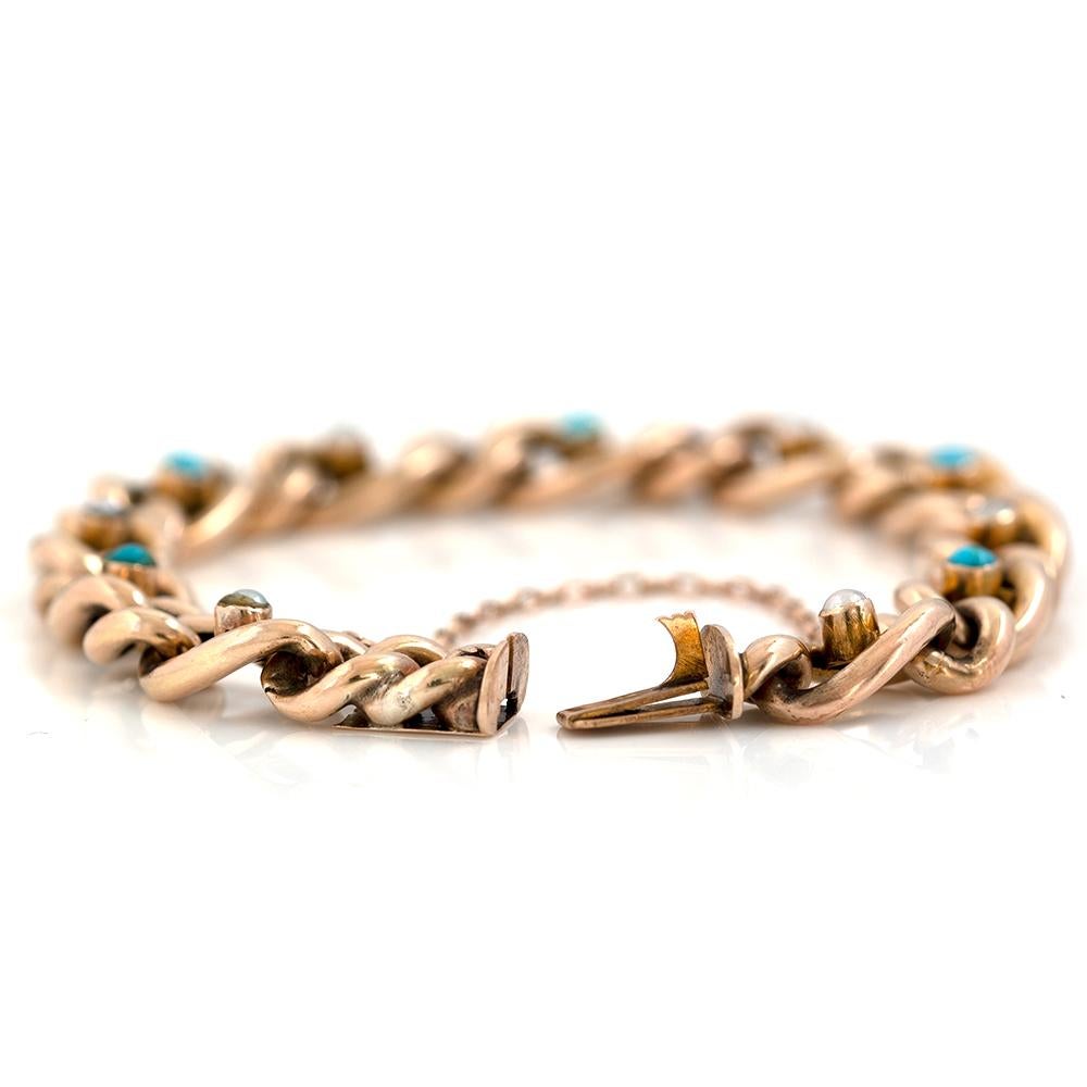 Our exquisite antique Edwardian bracelet is crafted from 9ct gold. The bracelet has curb shaped links with beautiful alternating bright blue turquoise gemstones and white pearls. The bracelet has a push clasp with a secondary safety chain for extra