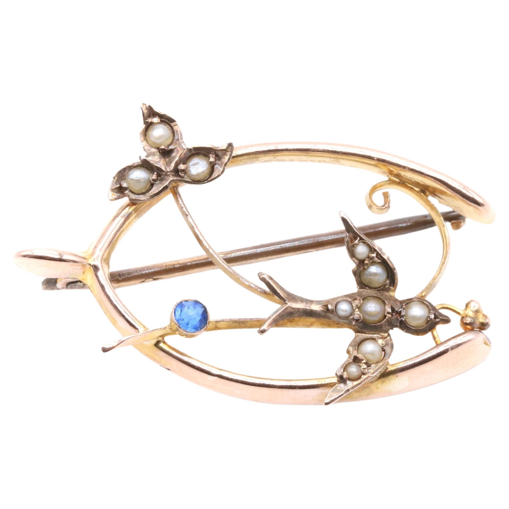 Antique Edwardian 9K Yellow Gold Blue Paste and Pearl Swallow Wishbone Brooch For Sale