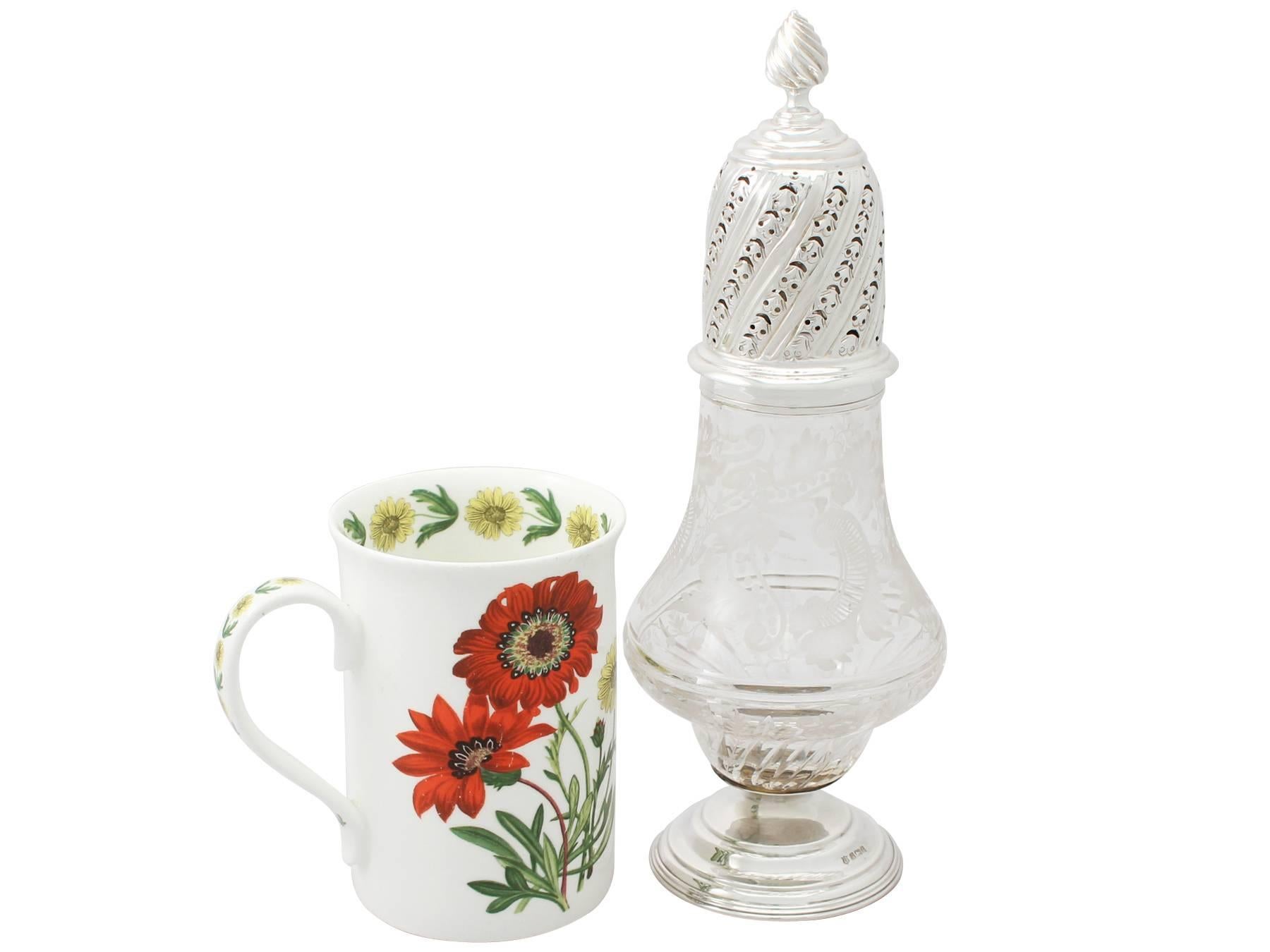 A fine and impressive antique Edwardian acid etched glass and English sterling silver mounted sugar caster; an addition to our silver teaware collection.

This fine antique Edwardian silver sugar caster has a baluster shaped form.

The upper