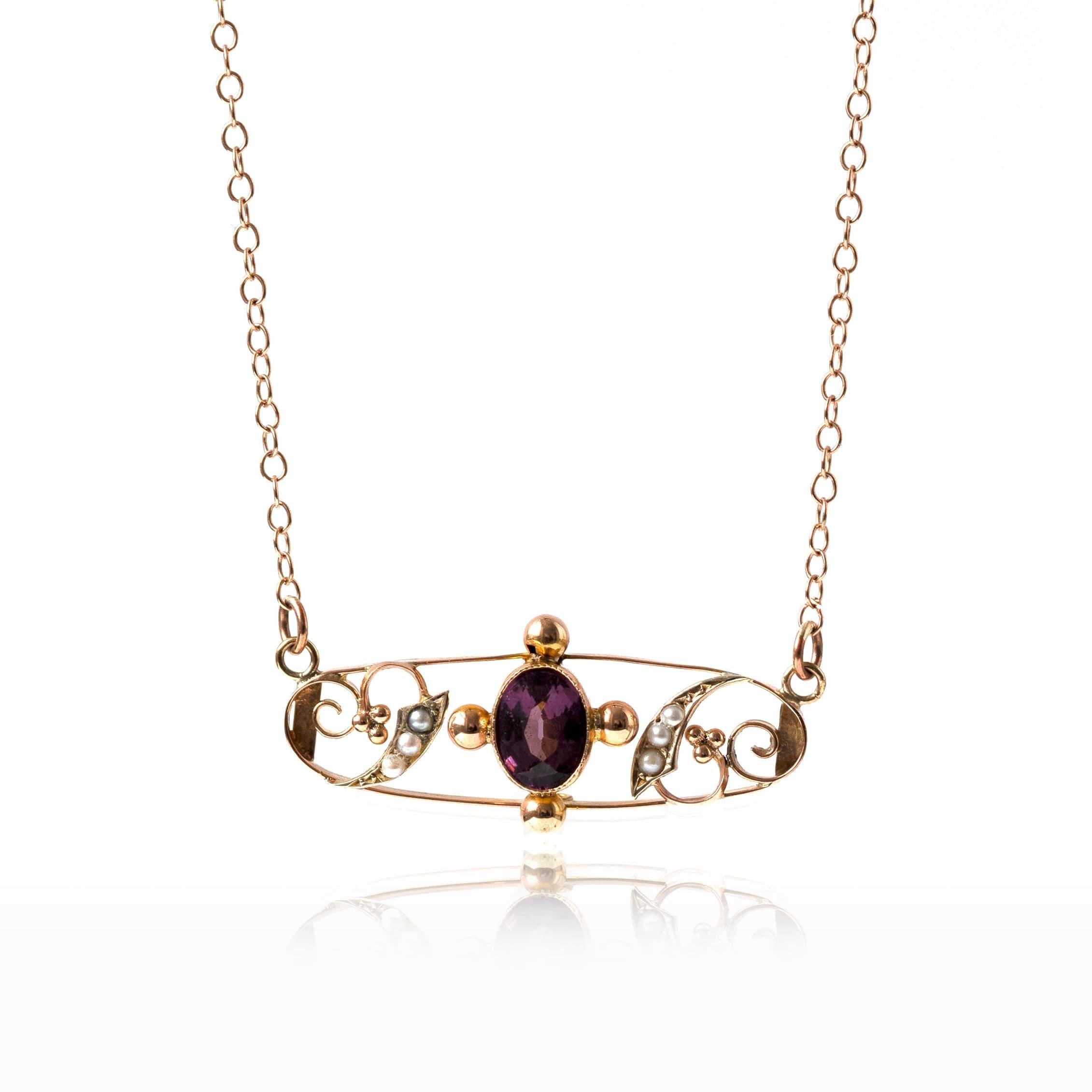 Antique Edwardian 9ct rose gold bar necklace featuring seed pearls and Amethyst. Pearls in the Victorian era were associated with a number of symbols such as innocence, purity, humility and harmony. 

This piece was converted from a brooch into a