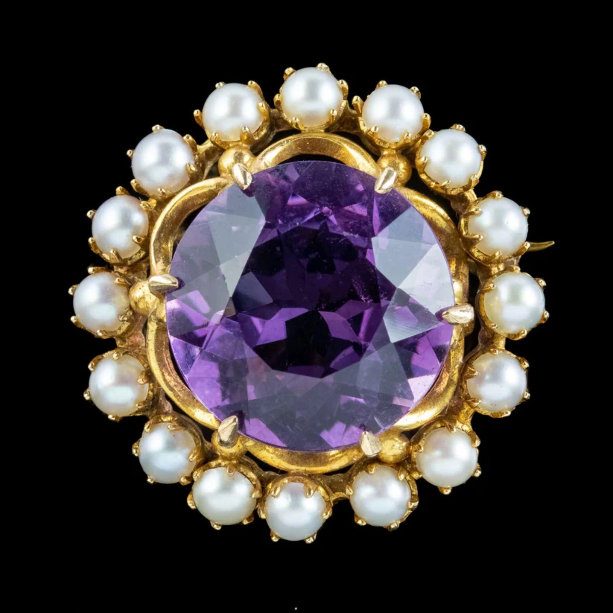 A glorious antique Edwardian brooch from the early 1900s built around a sizable amethyst in the centre, weighing approx. 20ct. It has a deep, regal purple hue and is complemented by a halo of bright, white pearls around the outside.  

Amethyst is