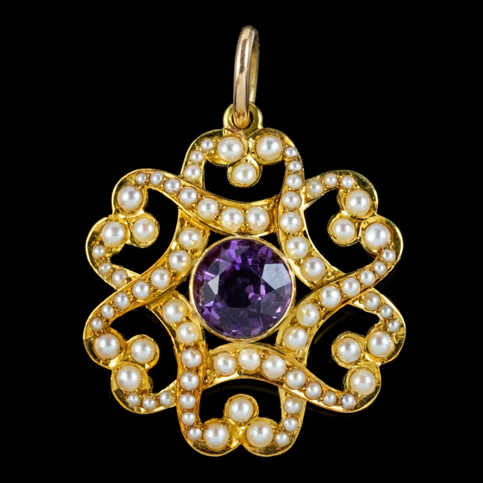 A pretty antique Victorian pendant made by London jewellers “Gresham Barber & Co” in the early 20th century. The piece is fashioned in 15ct gold with a fabulous overlapping design decorated with pearls and a bezel set amethyst in the centre weighing
