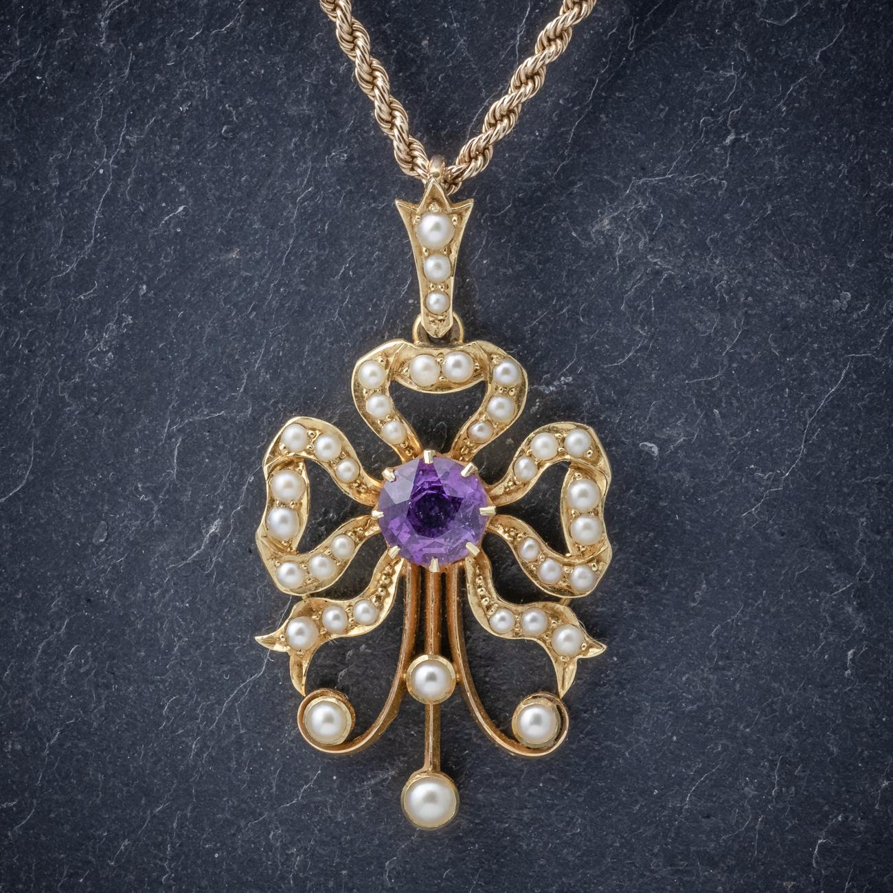A lovely antique Edwardian necklace C. 1910 featuring a pretty pendant decorated with Pearls and a 0.70ct Amethyst. The pendant is a lovely unusual design and set in 15ct Yellow Gold. This is accompanied by a wonderful rope twist chain fitted with a