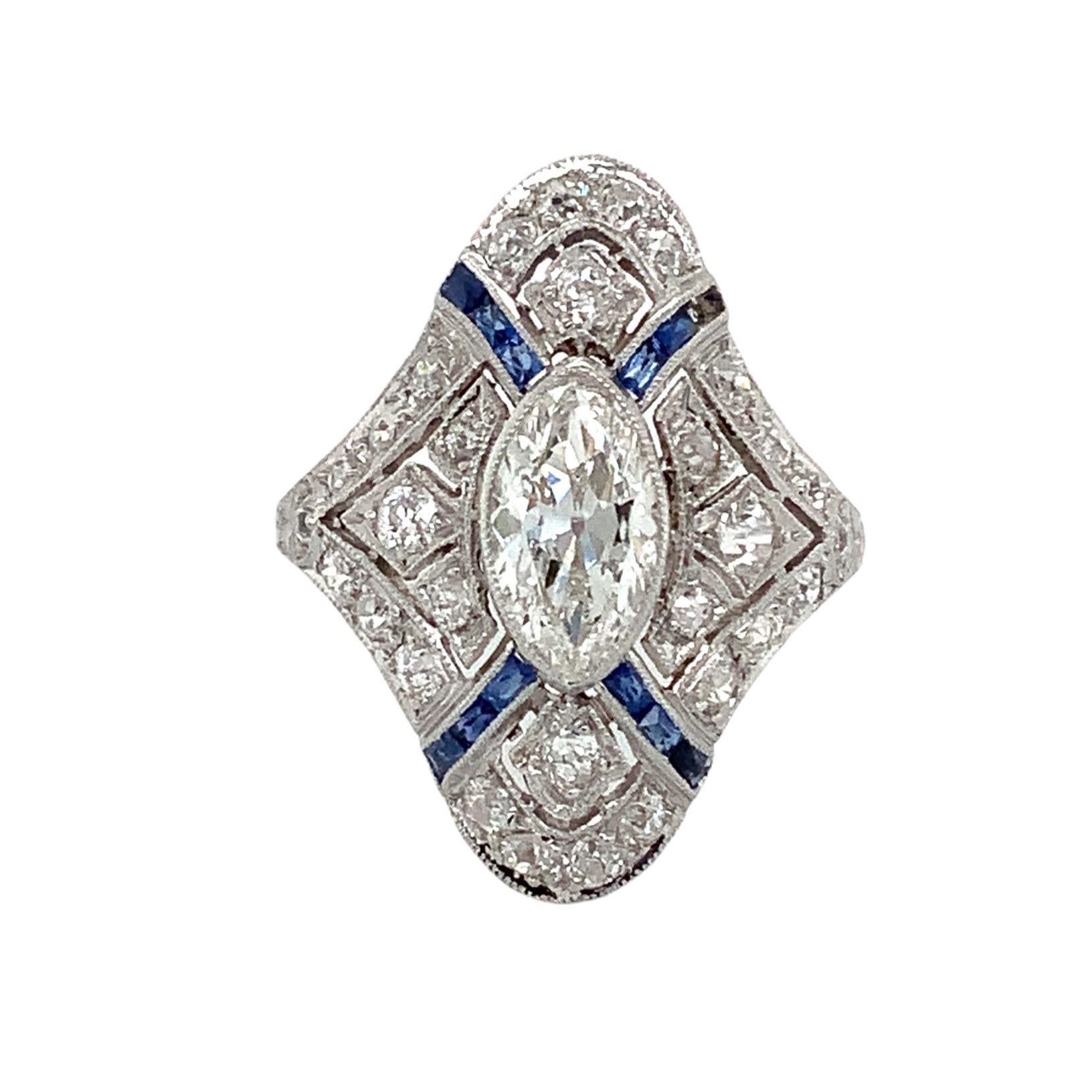 Antique Edwardian Art Deco Filigree Marquise Diamond and  Caliber Sapphire Ring set in Platinum. Circa 1910
Marquise 8.85 x 5.00 x 3.01 = 0.88 cts estimated H in Color VVS 2 in Clarity
30 Old Mine Cuts = 0.66cts estimated H in Color VS-SI in