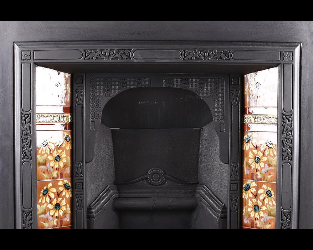 Antique Edwardian Art Nouveau Fireplace Insert
Antique Edwardian Art Nouveau cast iron and tiled fireplace insert with repeating Art Nouveau design to the frame, circa 1905.

Stock No: RG1933
          