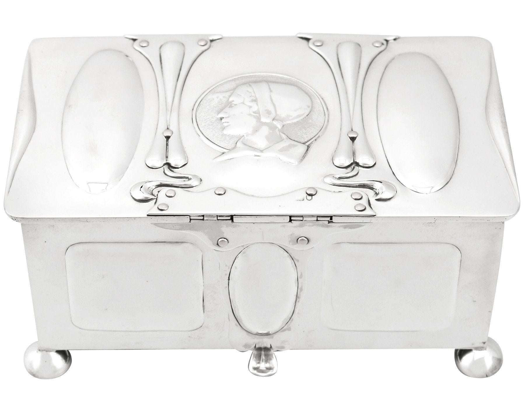 An exceptional, fine and impressive antique Edwardian English sterling silver jewelry casket made in the Art Nouveau style; an addition to the ornamental silverware collection.

This exceptional Edwardian sterling silver jewelry casket has a