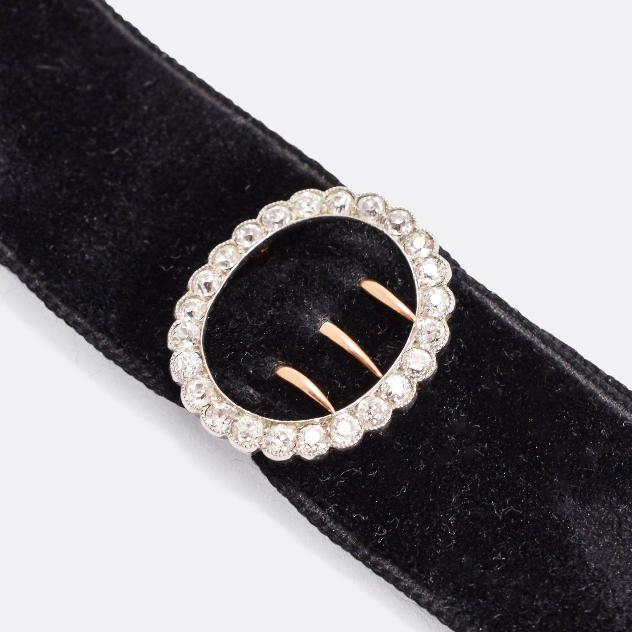 An excellent Edwardian era black velvet collar with a diamond halo buckle and gold clasp. It's set with a little over a carat of old Euro diamonds, resting in platinum millegrain settings. 

STONES 
1.1 carats of old European cut
