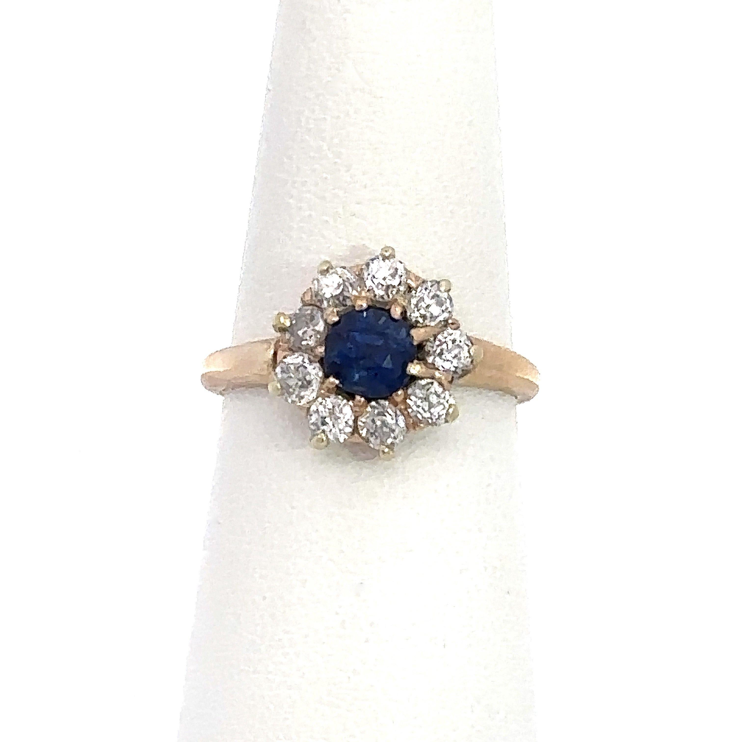 This antique Edwardian 14KT yellow gold cluster ring dates from the early-1900’s and features a stunning .70ct vibrant blue old European cut sapphire surrounded by approximately 1CT of sparkling old European cut diamonds, G-H color, SI clarity. The