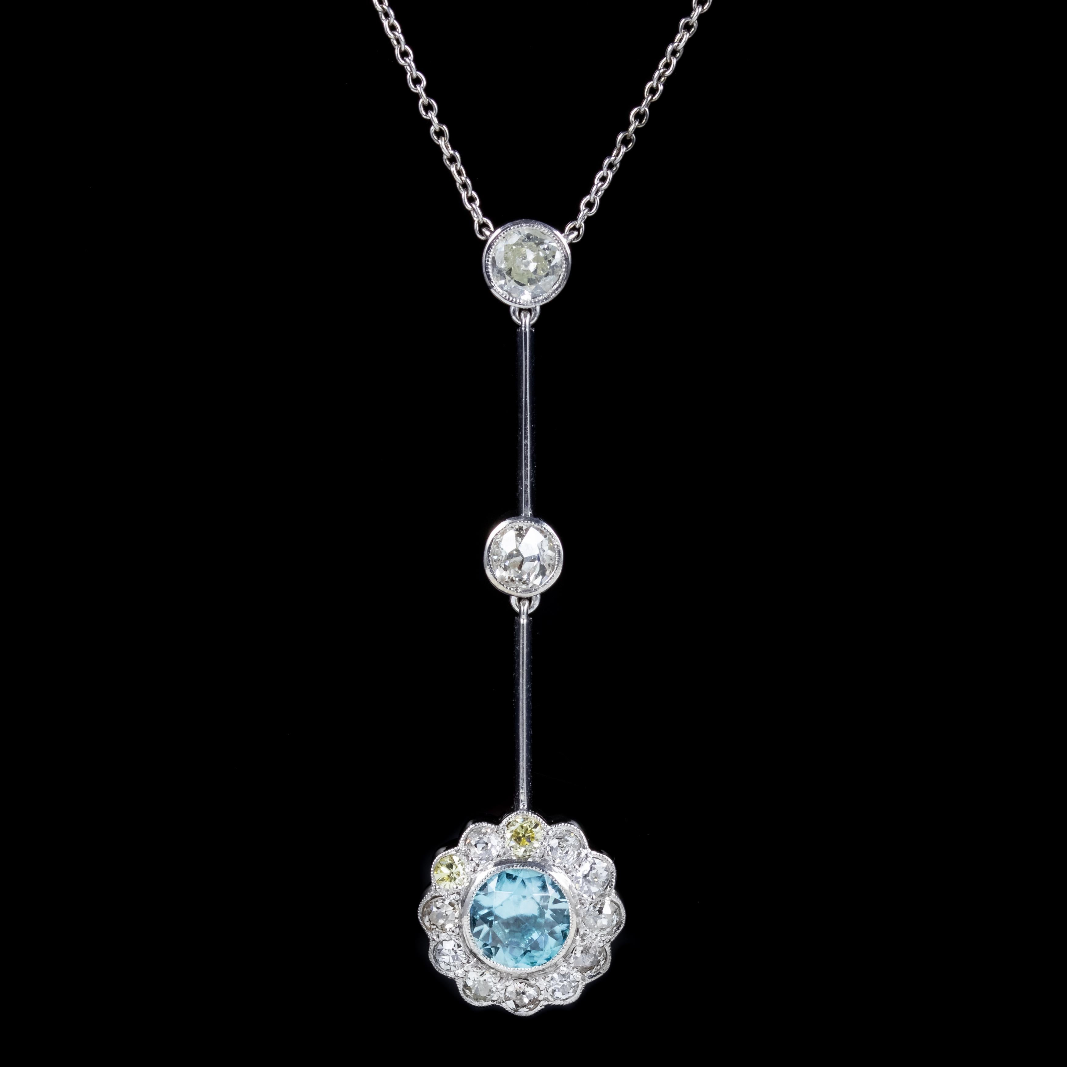 A stunning antique Edwardian lavaliere necklace showcasing a beautiful double drop pendant set with two old cut Diamonds leading to a flower shaped gallery at the bottom adorned with a 1.20ct blue Zircon haloed by more Diamonds.

The largest