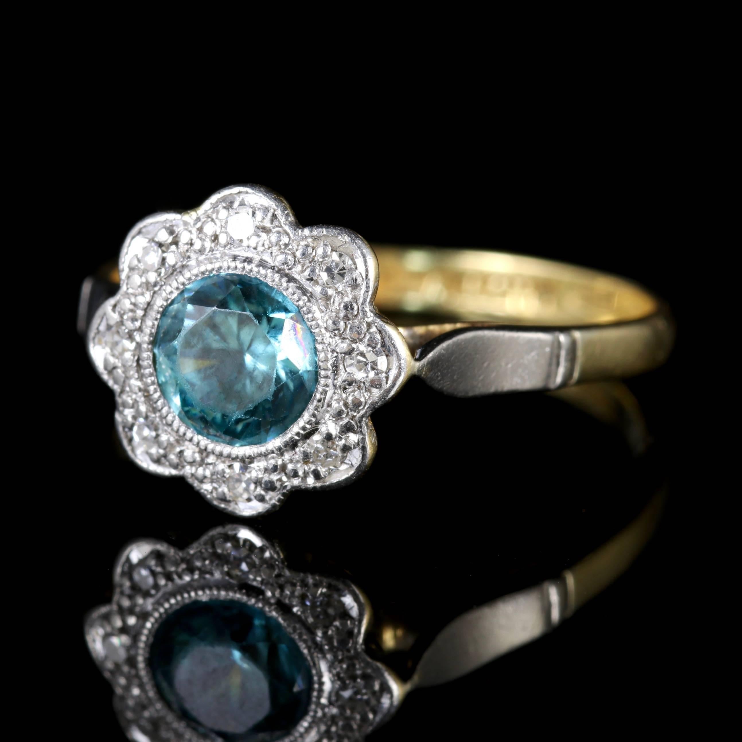 This wonderful Edwardian 18ct Yellow Gold and Platinum ring boasts a Blue Zircon and lovely Diamonds, Circa 1915.

The Blue Zircon is approx. 70 points surrounded by old cut Diamonds.

Blue Zircons have an intense energy that is highly spiritual.