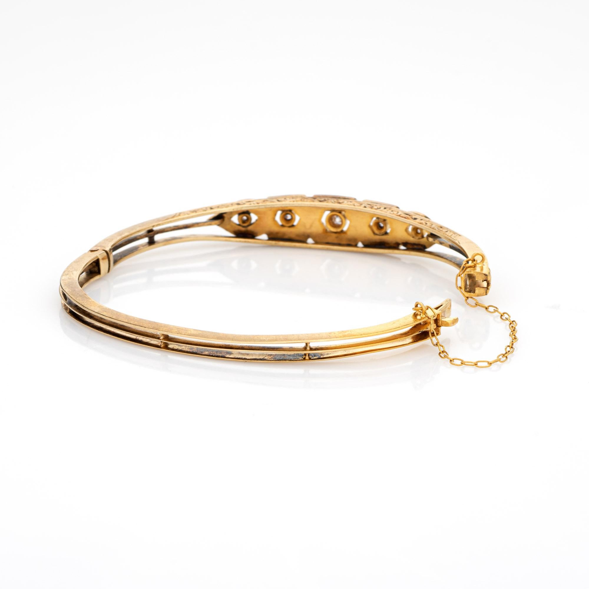 Finely detailed antique Edwardian era bangle (circa 1900s to 1910s), crafted in 14k yellow gold. 

Old mine cut diamonds range in size from 0.03 to 0.10 carats. The total diamond weight is estimated at 0.25 carats (estimated at K-L color and SI2-I1