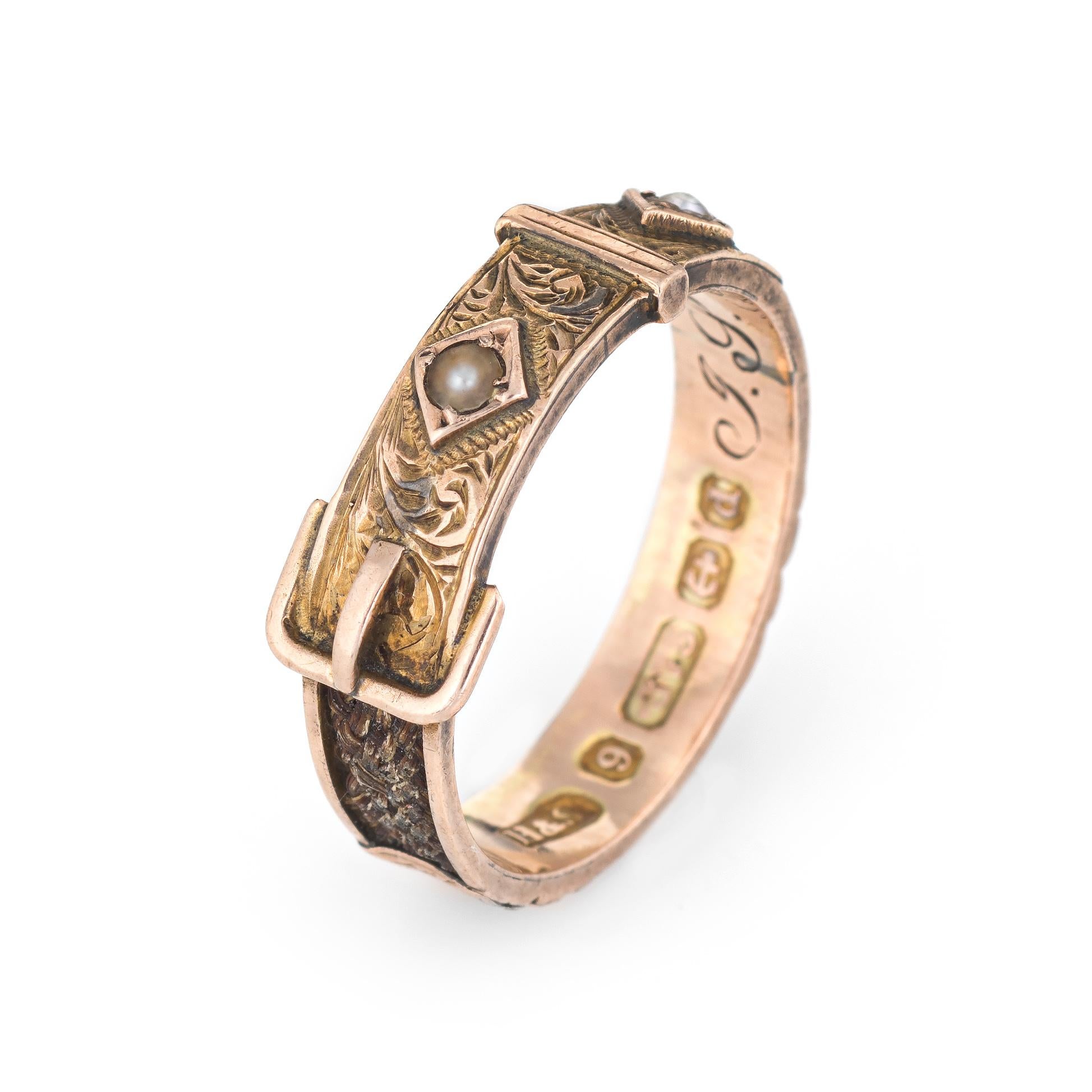 Antique Edwardian mourning ring (circa 1903), crafted in 9 karat rose gold. 

The antique ring features braided hair embedded into the band. Sectioned panels are etched in a star and foliate design. Hair is missing at the base of the ring (see