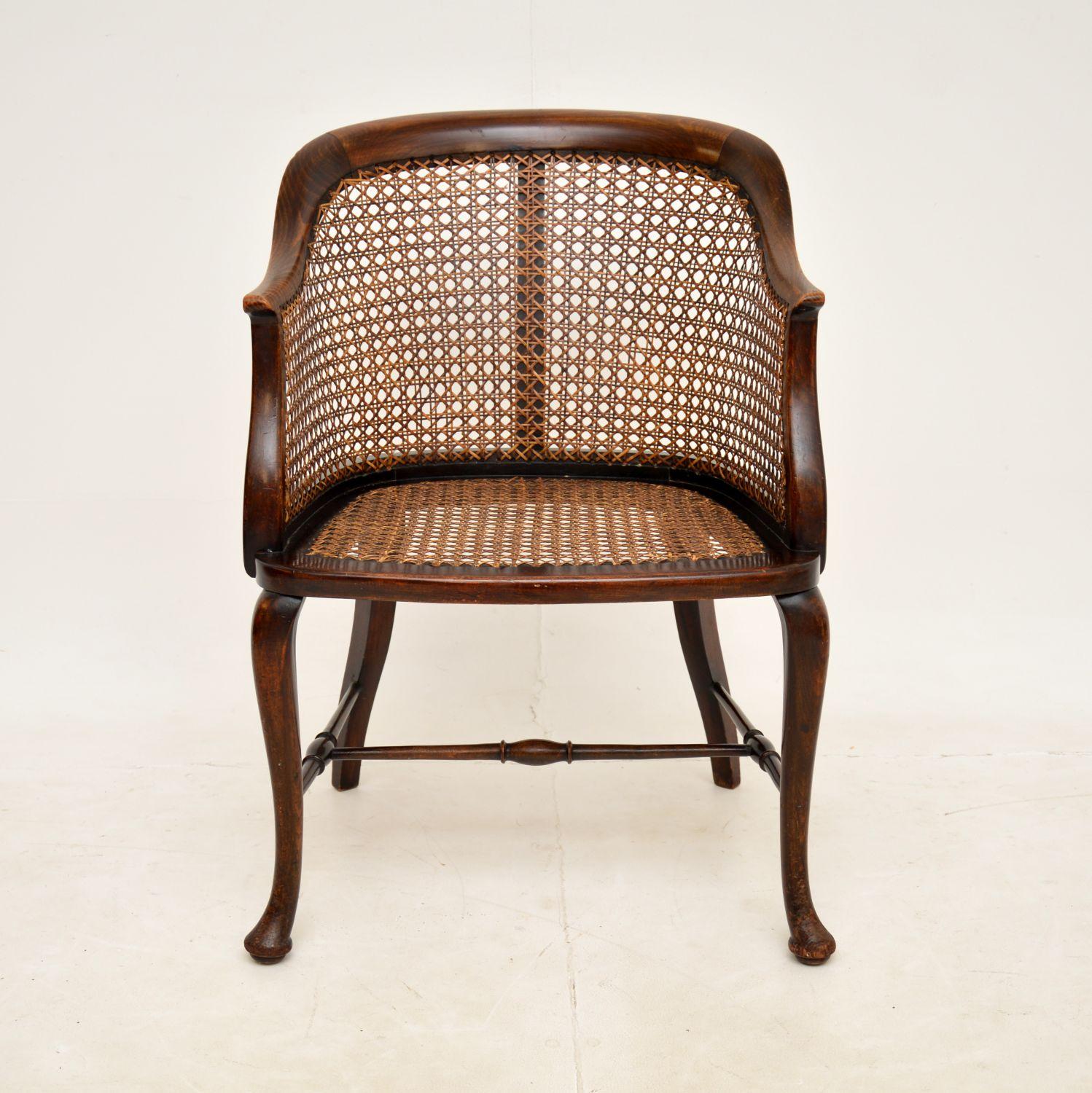 A beautiful and elegant antique side chair in solid beech, with a caned seat and back. This was made in England, it dates from around 1900-1910.

It is of lovely quality with gorgeous curves, the design is elegant yet sturdy. It is quite a petite