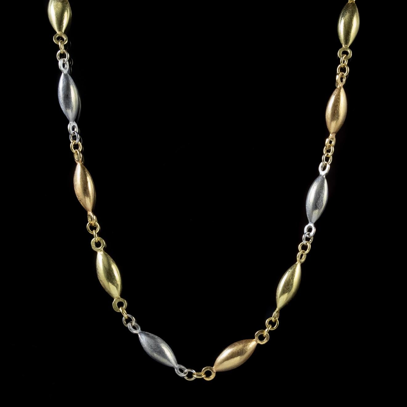 This wonderful, long antique chain has been beautifully preserved from the Edwardian era and is made up of fancy interchanging 18ct Yellow Gold and Platinum links.

Each link has a lovely smooth surface with lots of shine and fine engraved stripes.