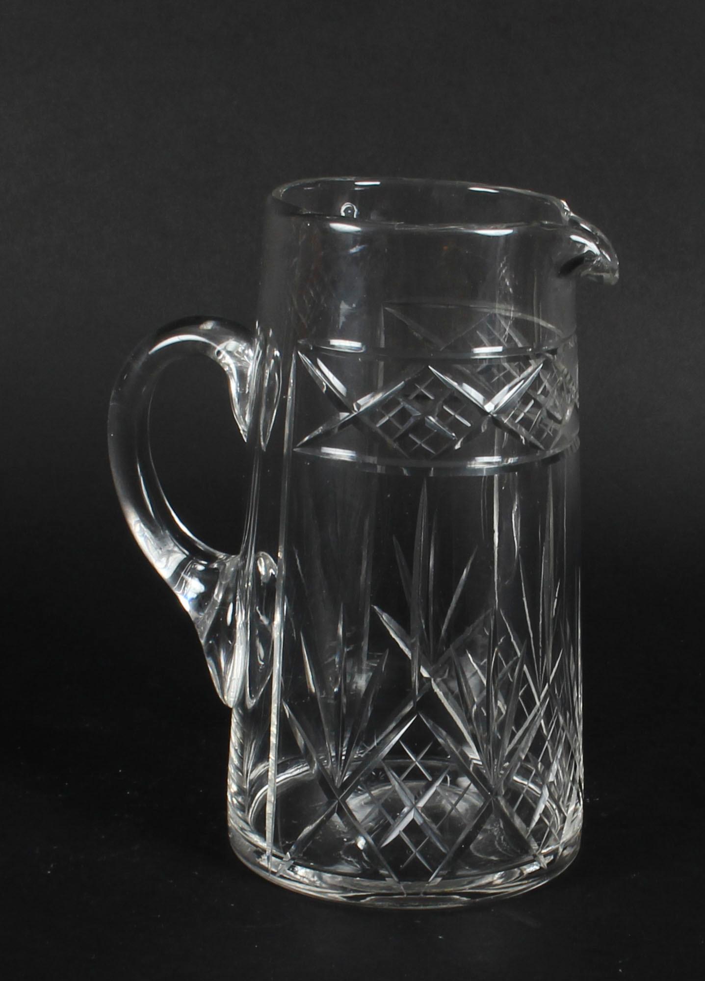 This is a splendid and high-quality antique cut crystal pitcher, dating from the early 20th century.
 
This delightful large jug features a stylish conical shape boasting stability and comforting weight. 
 
The clarity of the crystal makes it