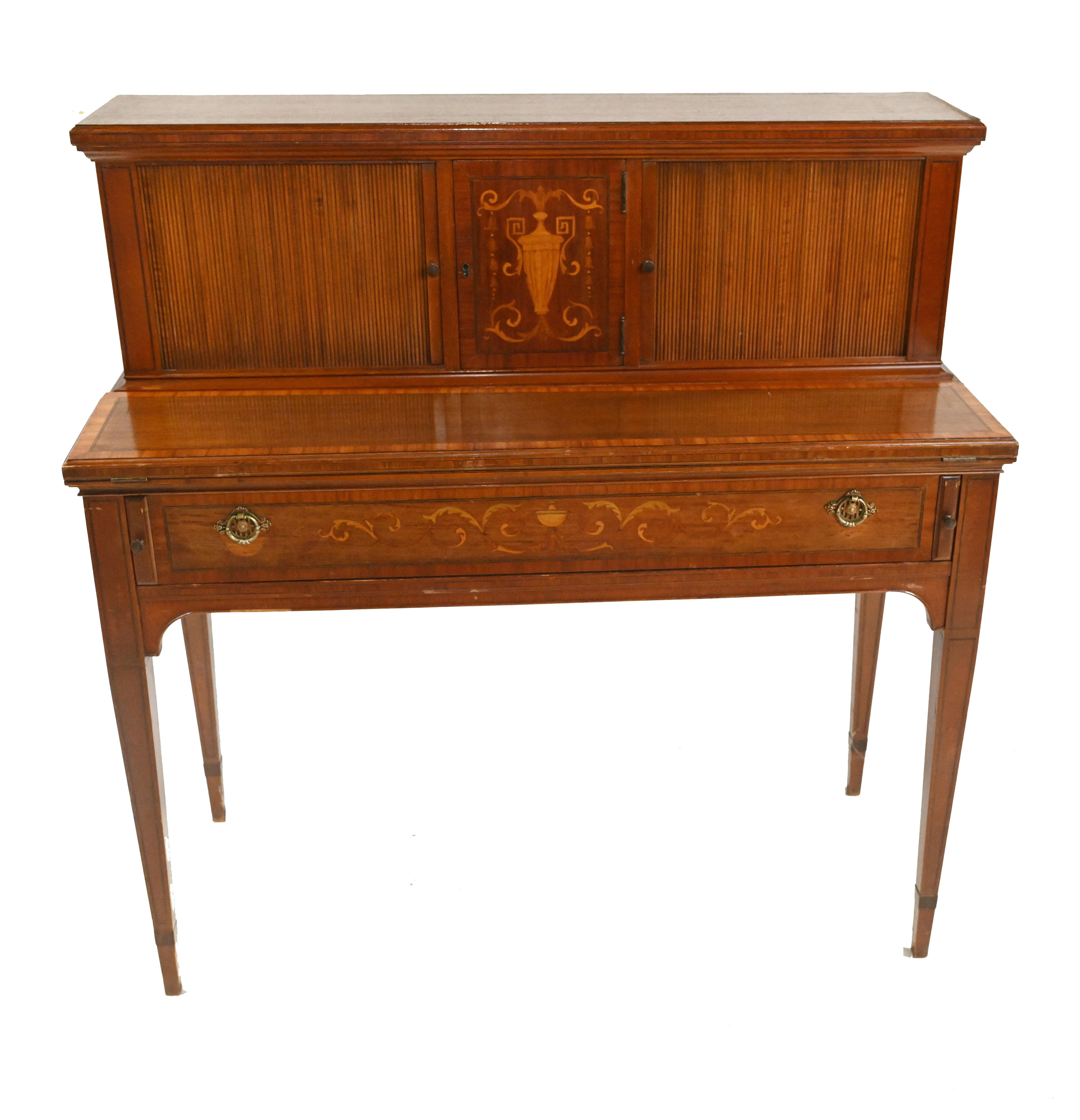 Gorgoeus antique Edwardian desk or writing table.
Circa 1910.
Crafted in mahogany with Sheraton style inlay work
Desk top opens out and cubby holes revealed by sliding doors
Charming, space saving, stylish piece
Offered in great shape ready for
