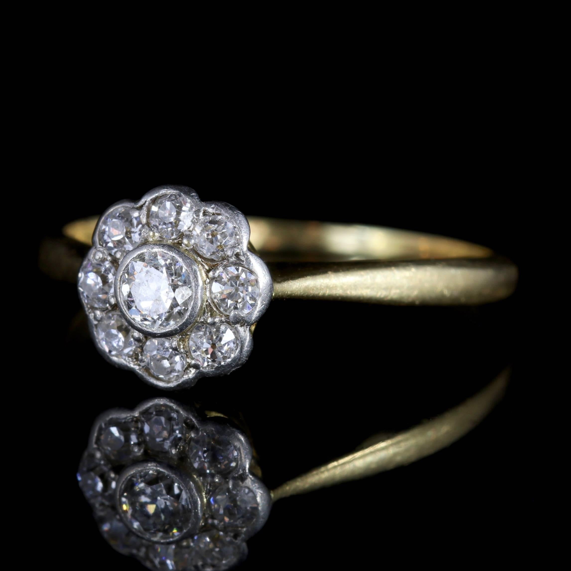 This stunning antique 18ct Gold, Diamond cluster ring is Edwardian Circa 1910. 

The beautiful flower shaped face is set with a 0.10ct old cut Diamond in the centre with 0.05ct Diamonds chasing around the gallery.

Diamond is the hardest mineral on
