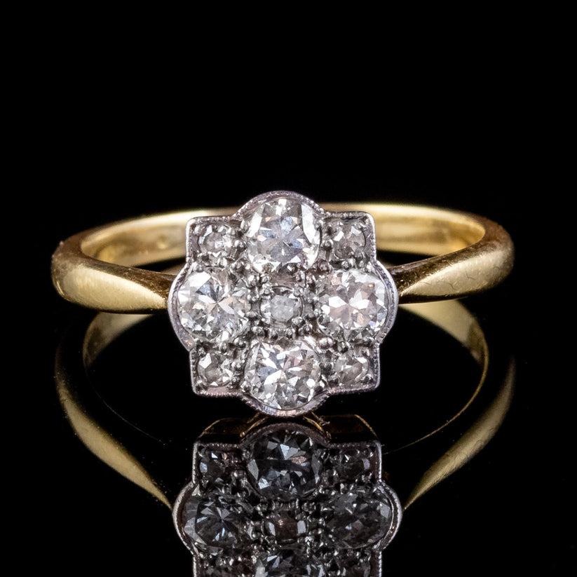 A pretty antique Edwardian cluster ring from the early 1900s pave set with four 0.10ct brilliant cut diamonds with five smaller single cut diamonds twinkling in between. They’re bright clean stones with excellent SI1 clarity – H colour and total